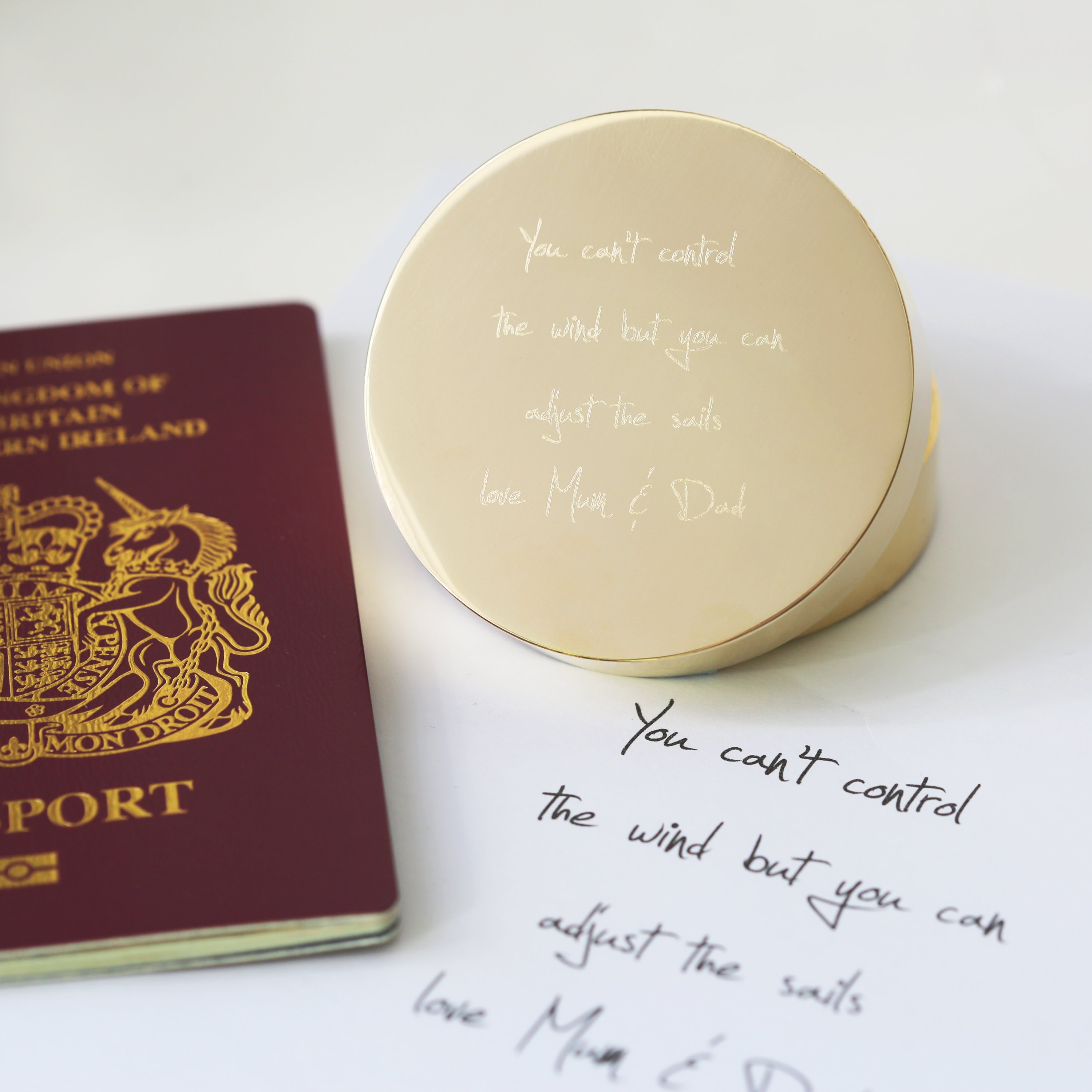 Personalised brass nautical sundial compass with custom handwriting engraving, complete with protective pouch and gift box.