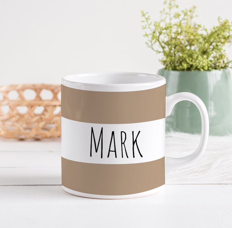 A personalized name mug with colorful borders, perfect for gifts.