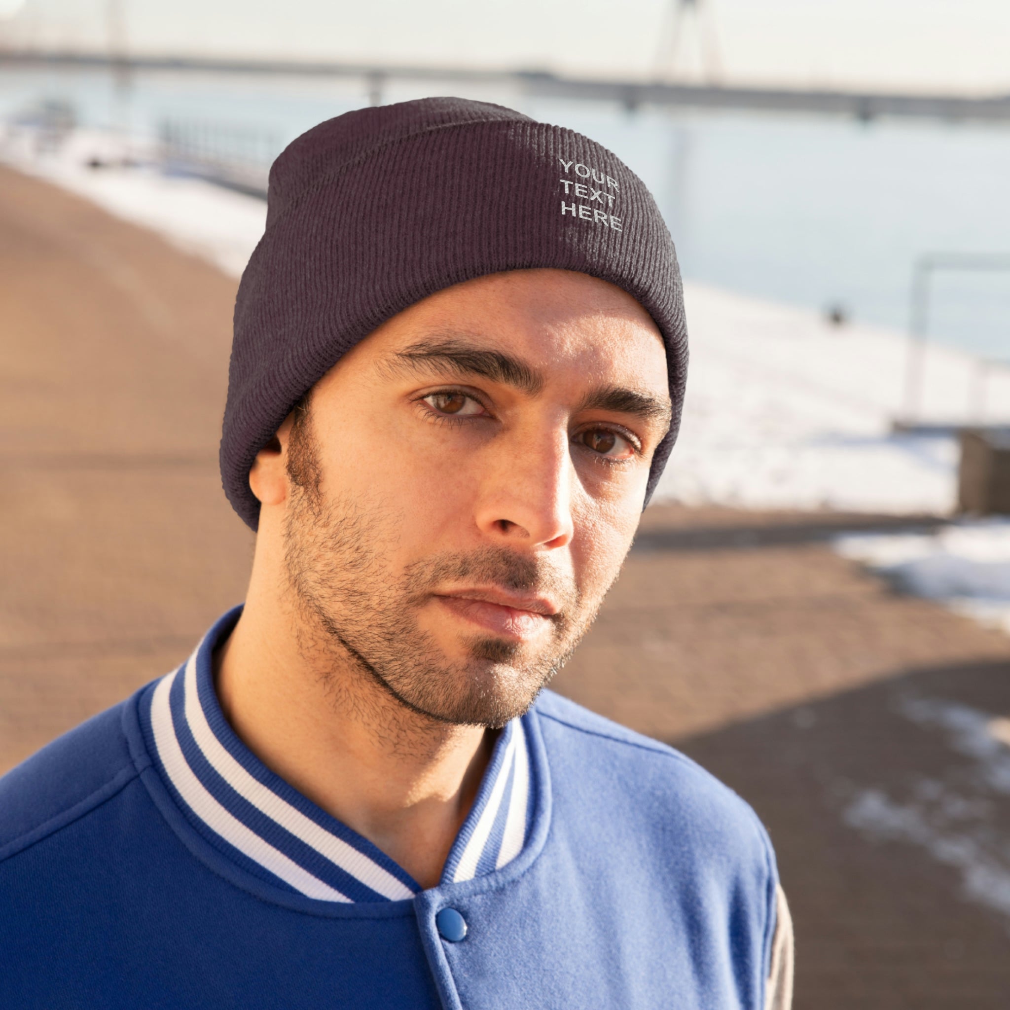 A cozy personalized knit beanie in various colors, featuring custom text options for a unique touch.