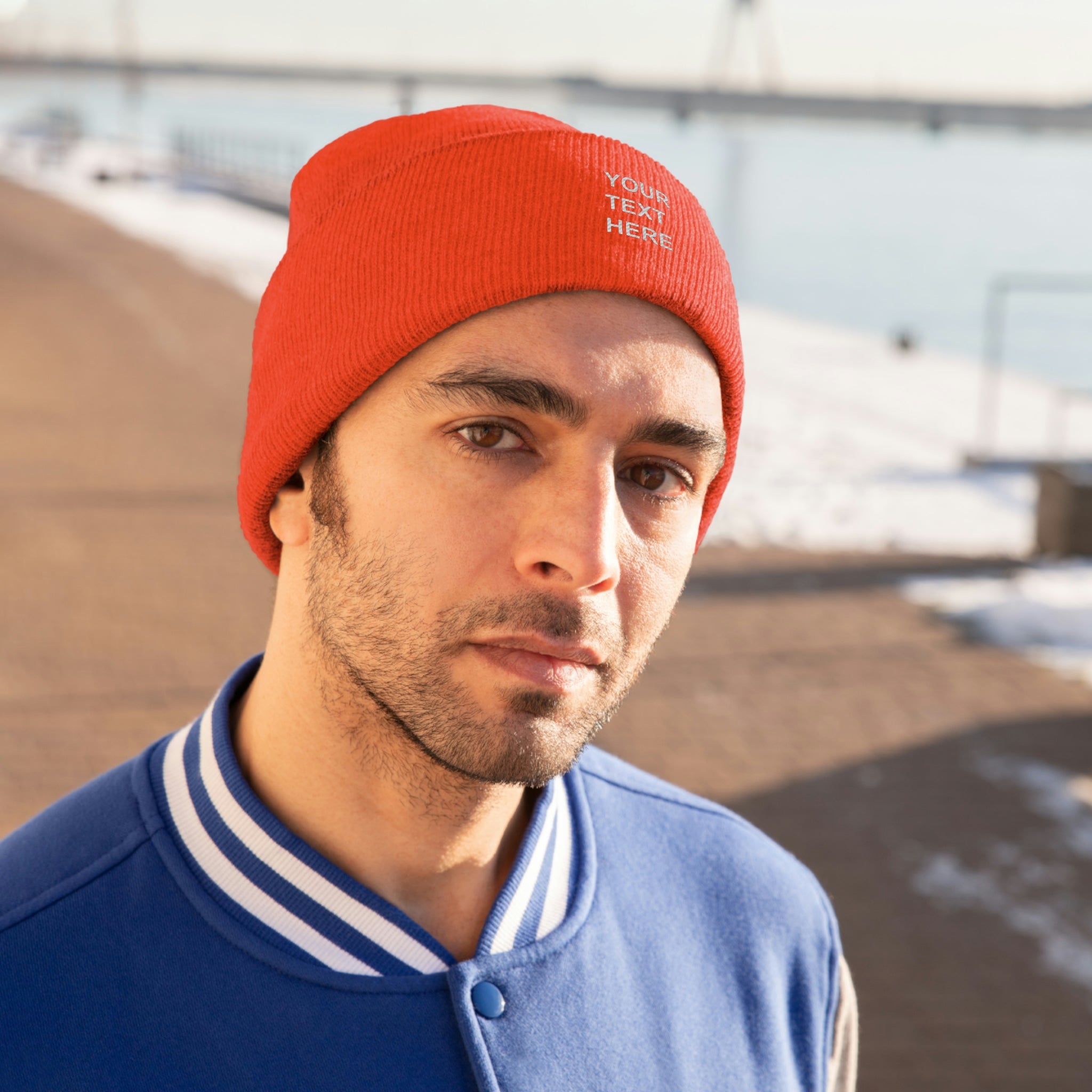 A cozy personalized knit beanie in various colors, featuring custom text options for a unique touch.