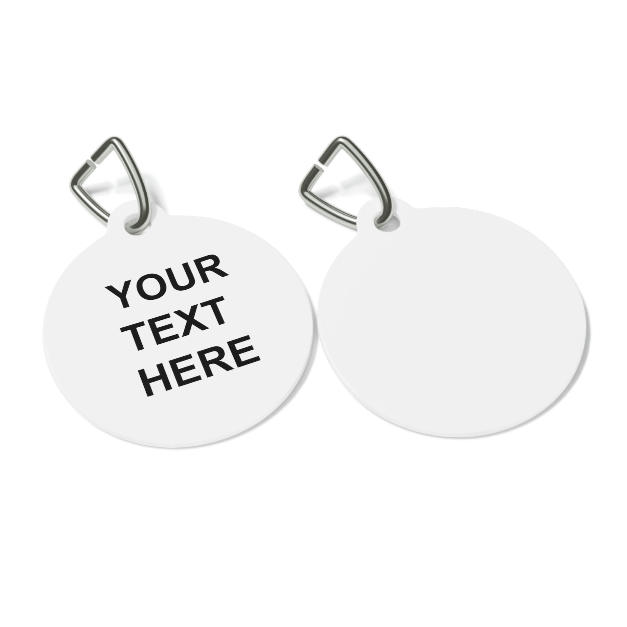 A personalized pet tag made of white coated metal, featuring custom text on both sides, attached with a sturdy metal clip.