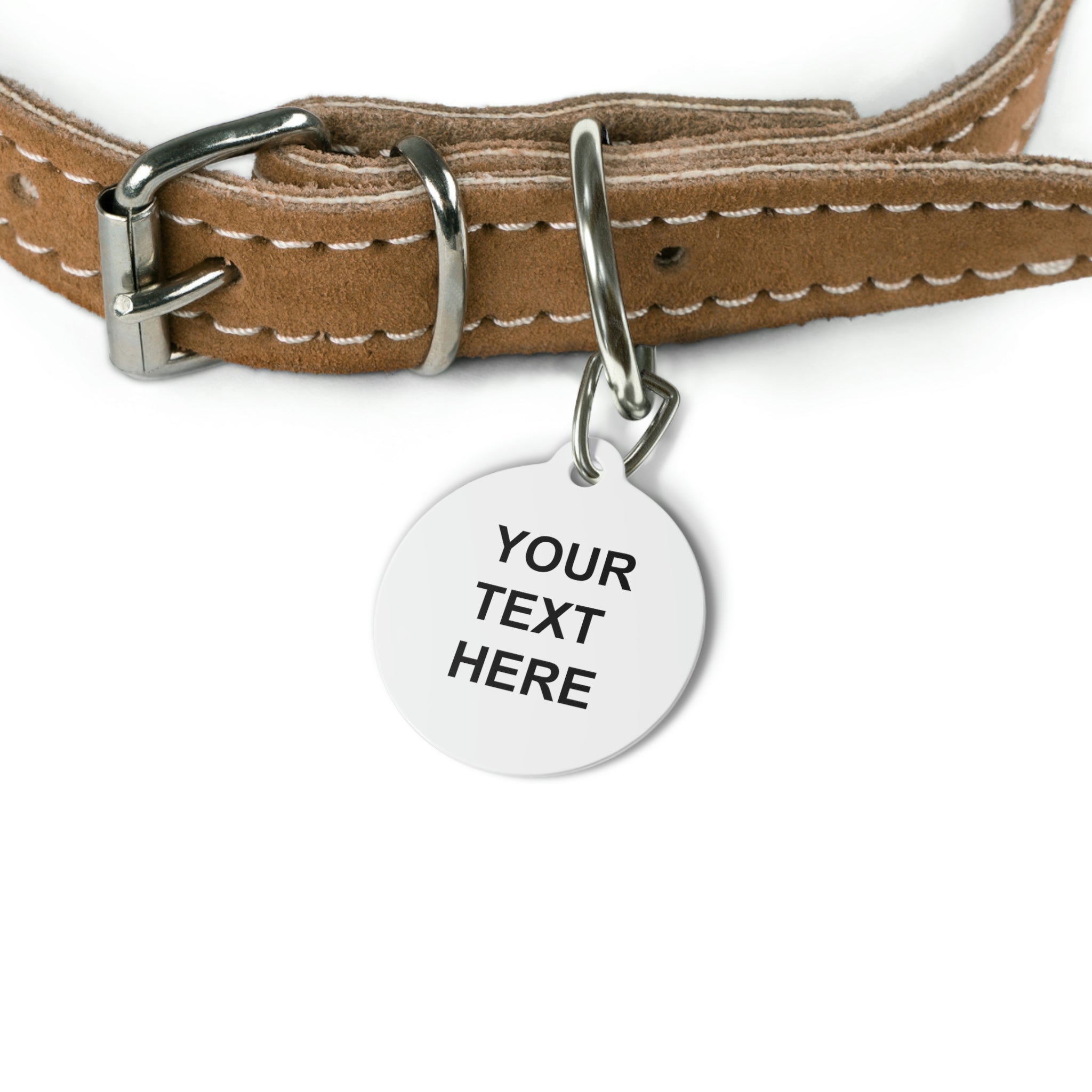 A personalized pet tag made of white coated metal, featuring custom text on both sides, attached with a sturdy metal clip.