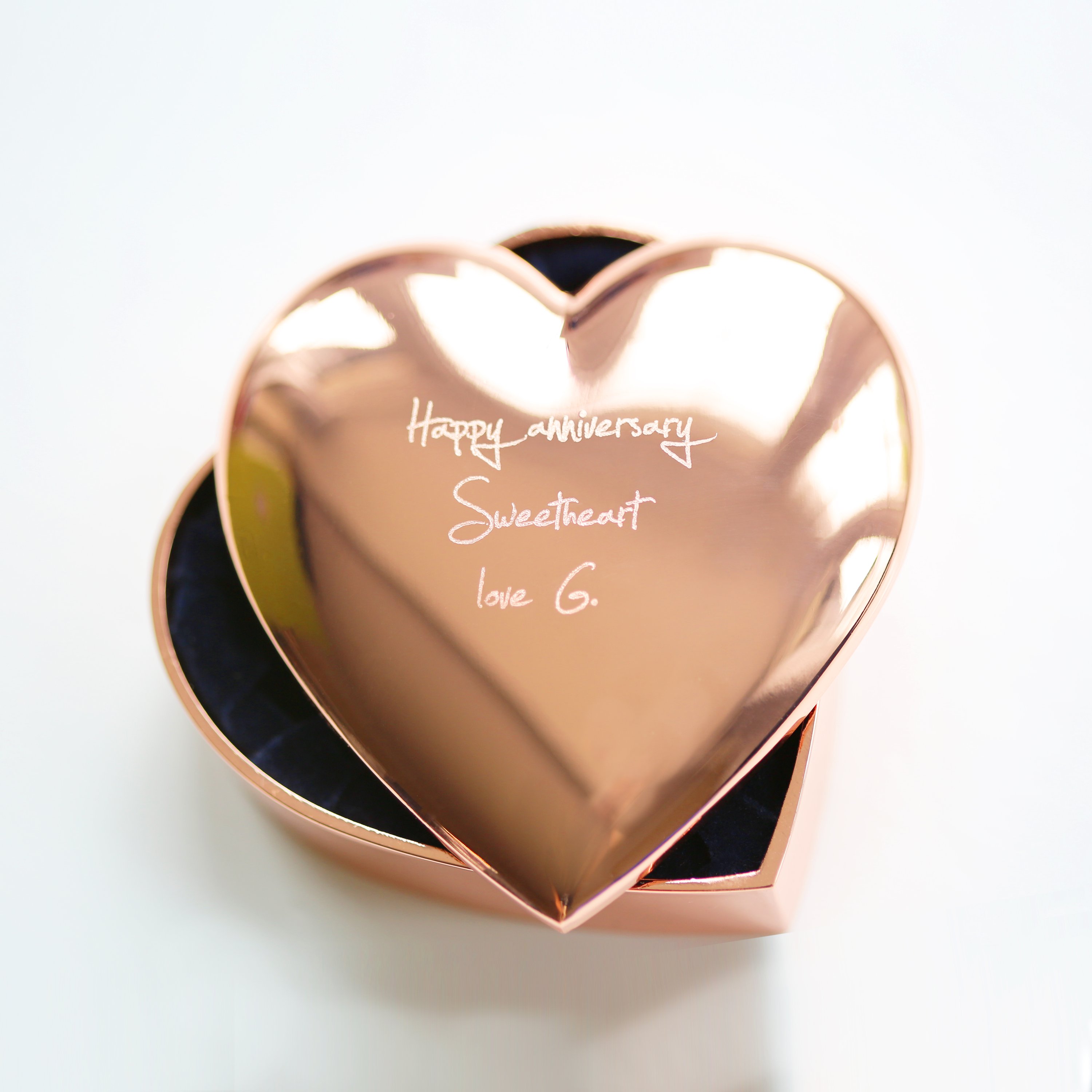A beautiful rose gold heart keepsake personalized with handwriting, showcasing its elegant design and sentimental value.