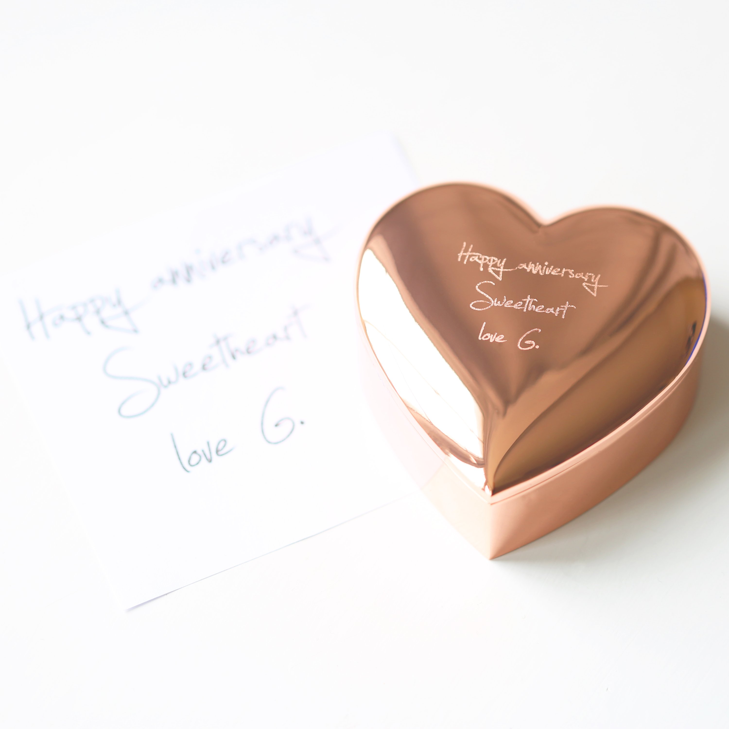 A beautiful rose gold heart keepsake personalized with handwriting, showcasing its elegant design and sentimental value.