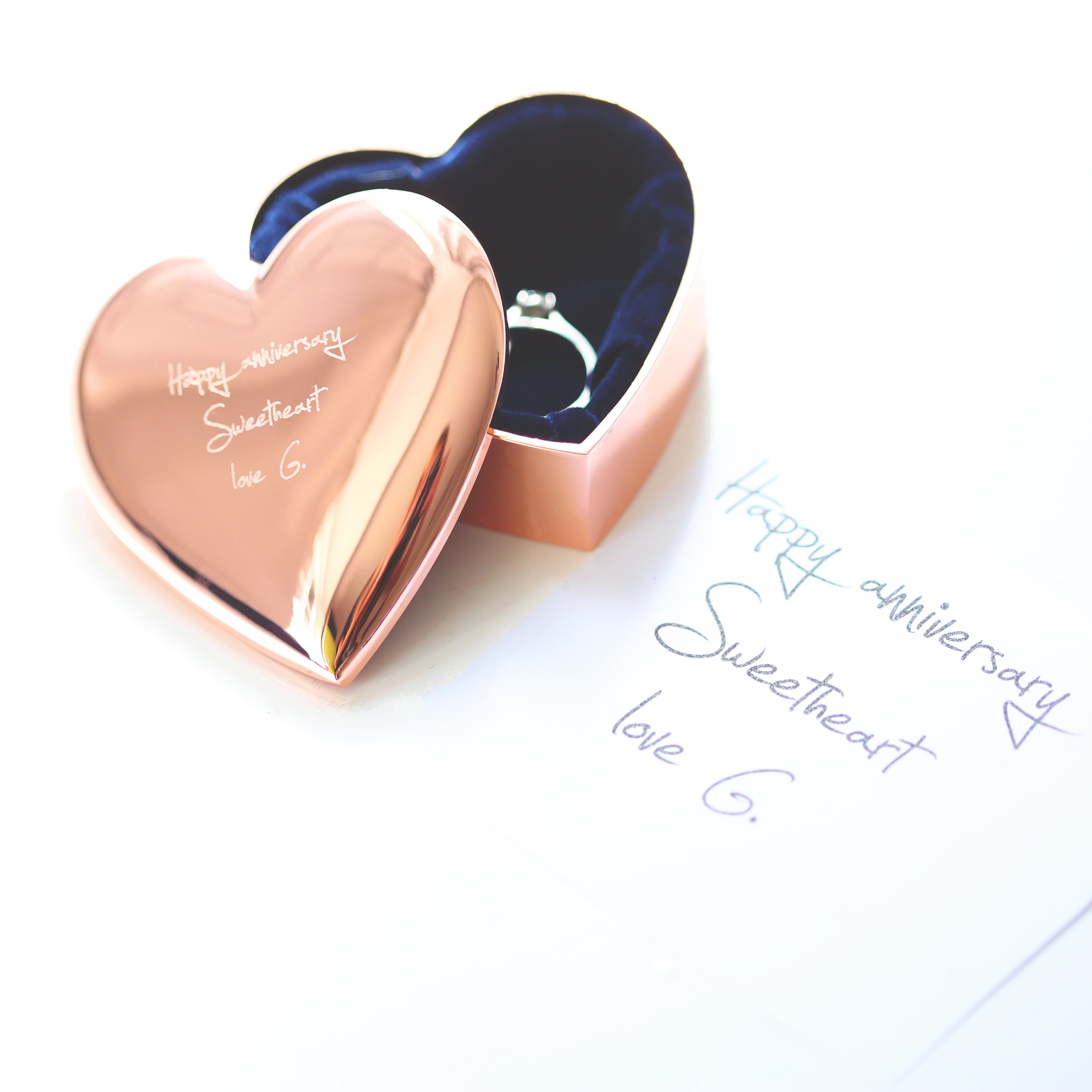 A beautiful rose gold heart keepsake personalized with handwriting, showcasing its elegant design and sentimental value.