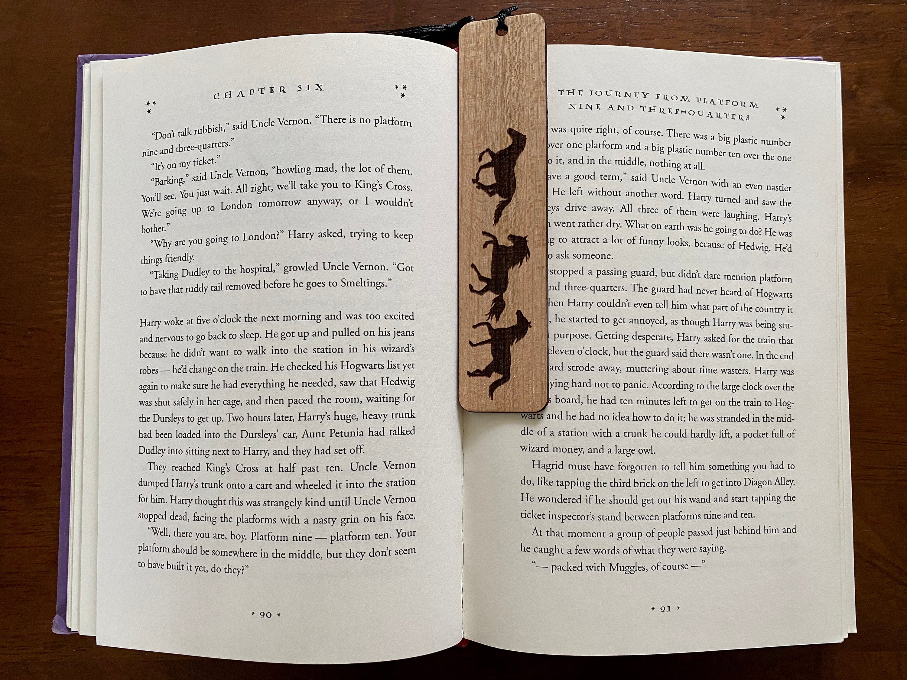 Engraved wood bookmark featuring galloping horses, made of cherry hardwood with a colorful tassel.