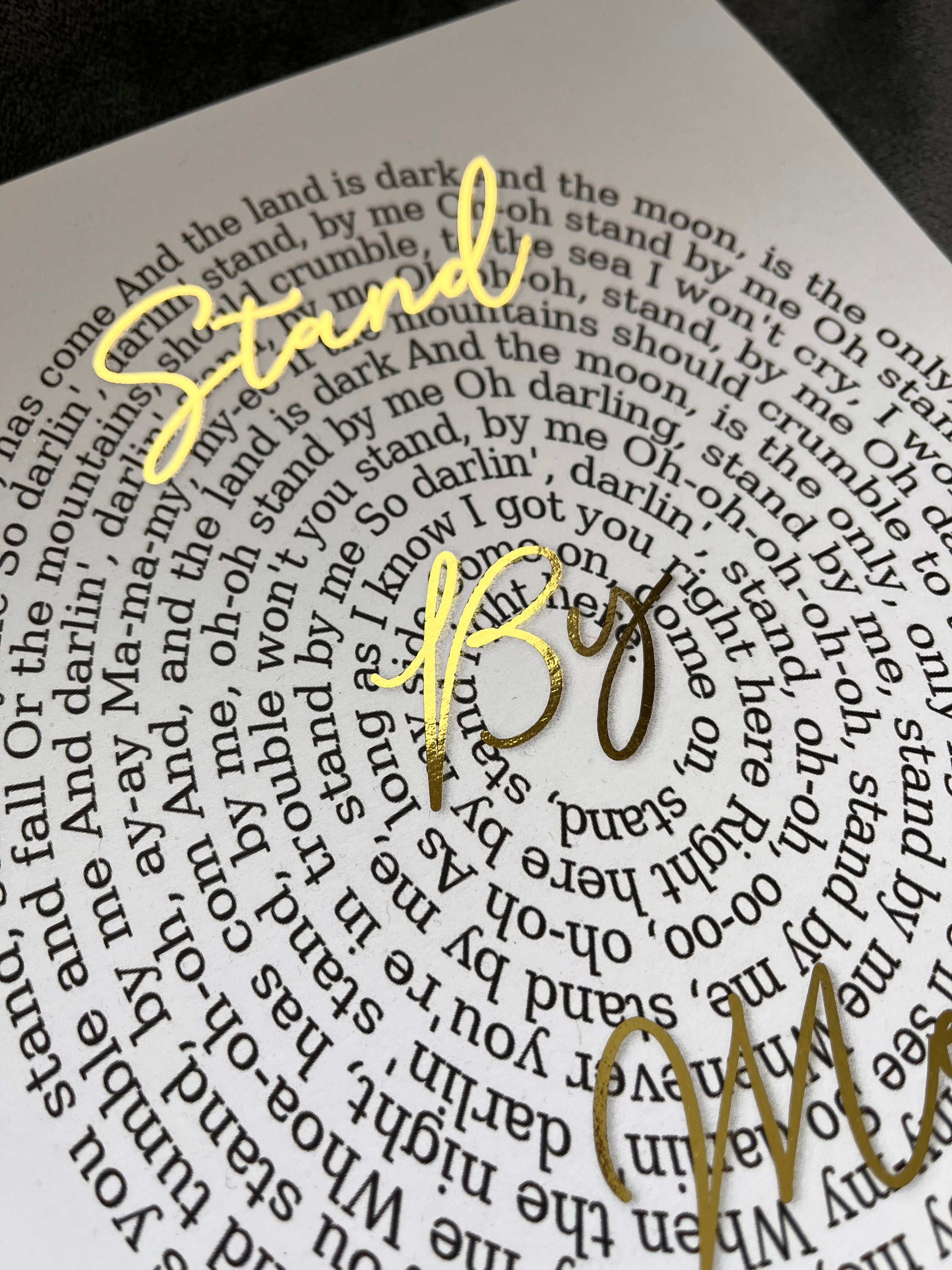 A beautifully designed Spiral Song Lyric Print featuring gold foil lyrics in an elegant spiral layout, personalized with names and song title.