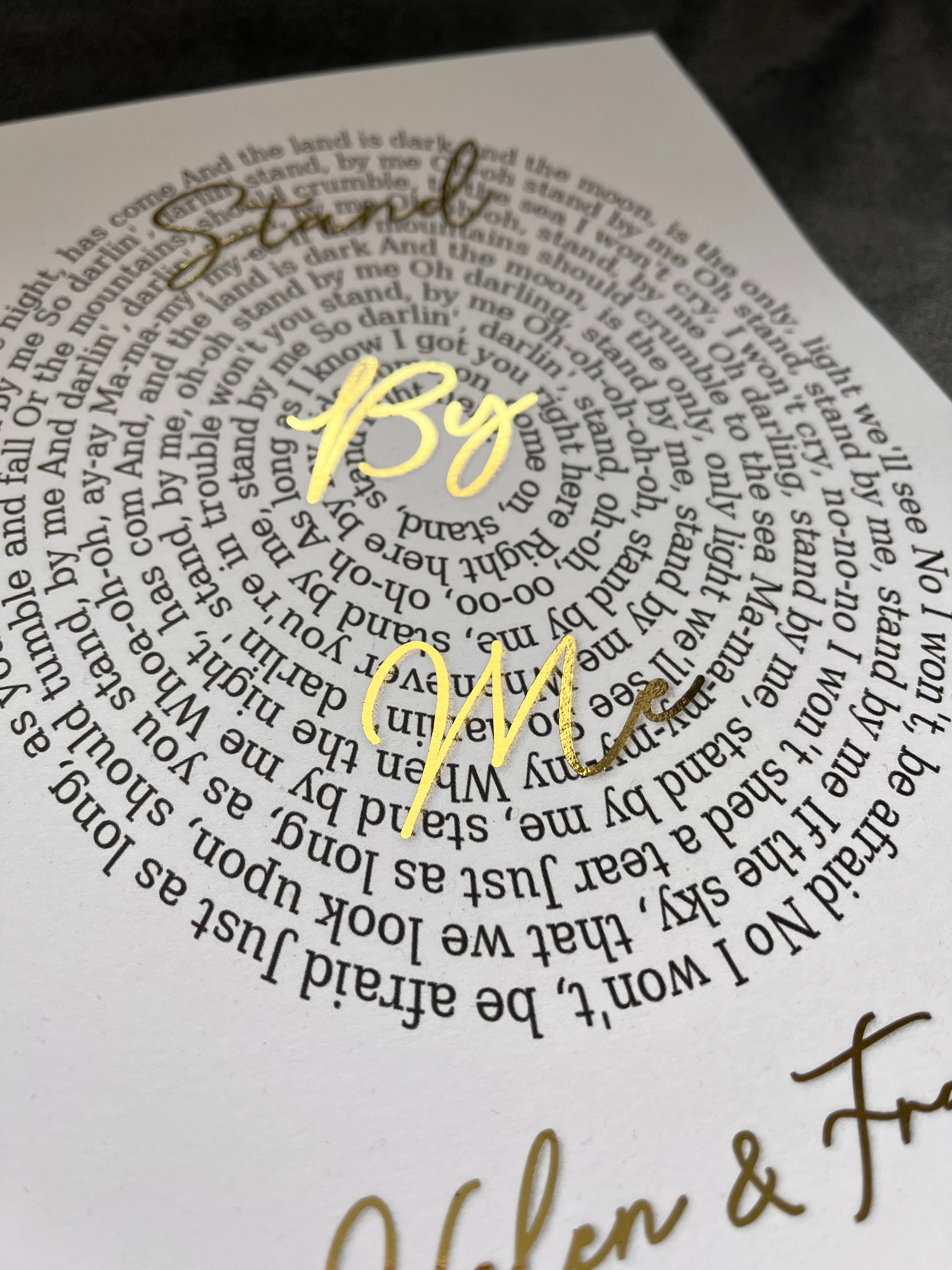 A beautifully designed Spiral Song Lyric Print featuring gold foil lyrics in an elegant spiral layout, personalized with names and song title.