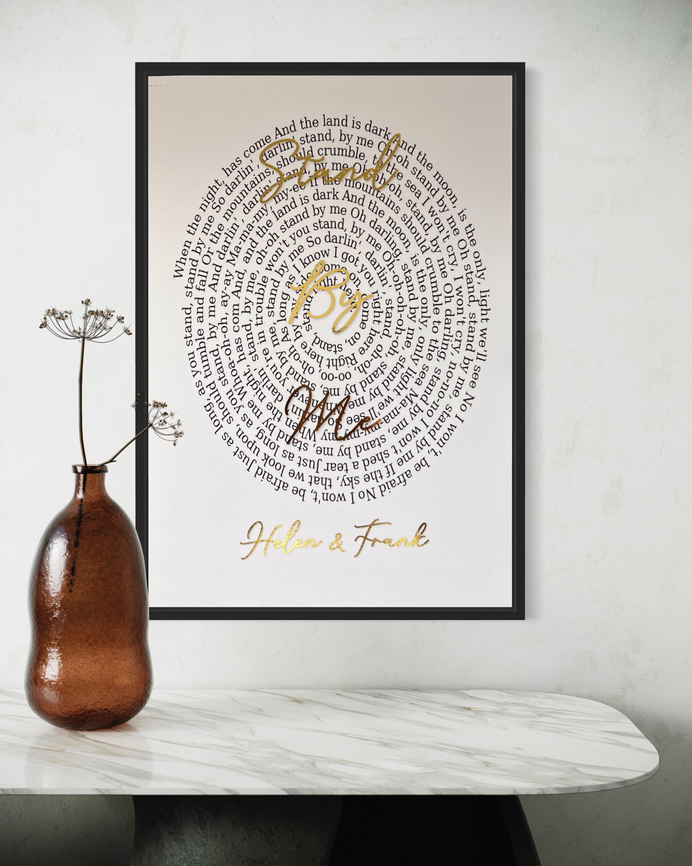 A beautifully designed Spiral Song Lyric Print featuring gold foil lyrics in an elegant spiral layout, personalized with names and song title.