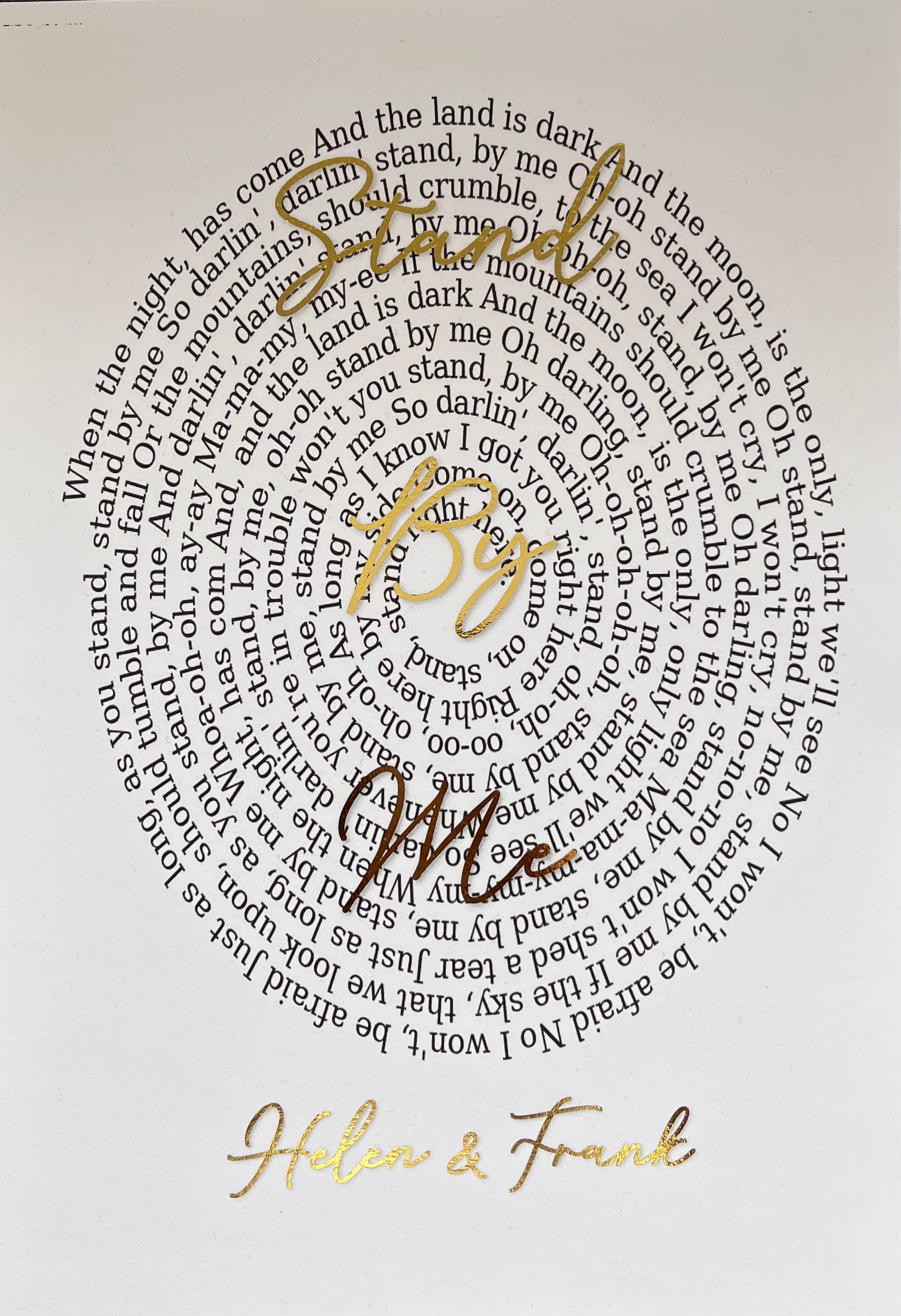 A beautifully designed Spiral Song Lyric Print featuring gold foil lyrics in an elegant spiral layout, personalized with names and song title.