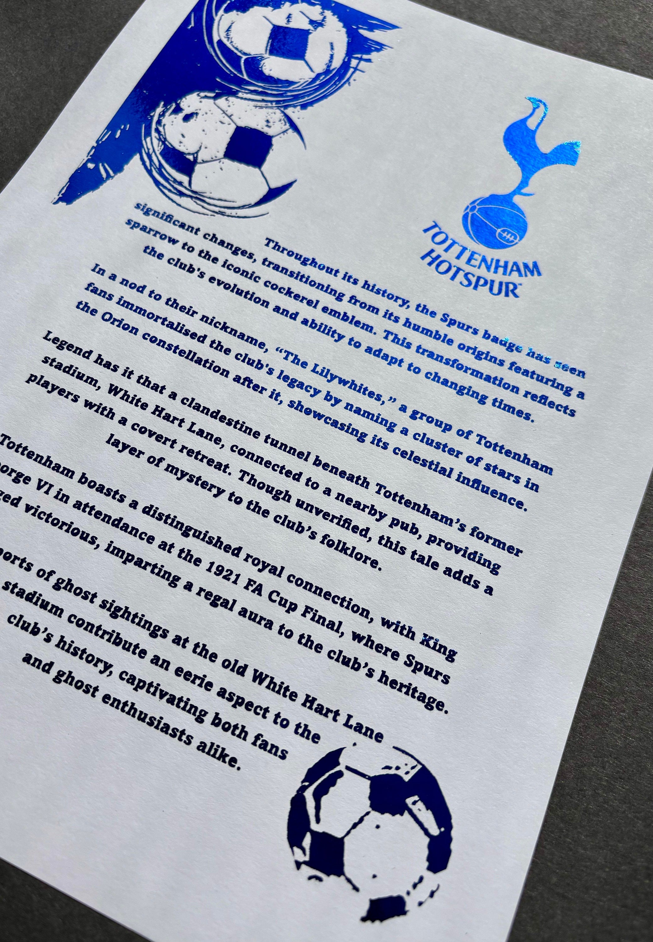 A4 foil print featuring the Tottenham Hotspur logo in blue foil, showcasing the club's rich history and tradition.