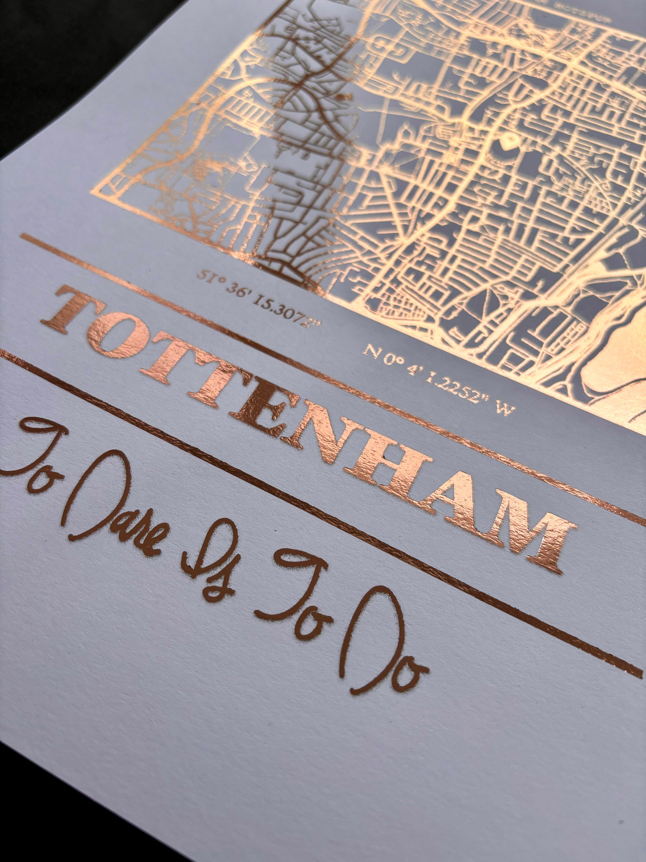Foil map print of Tottenham Hotspur Stadium featuring intricate detailing and coordinates, perfect for fans.