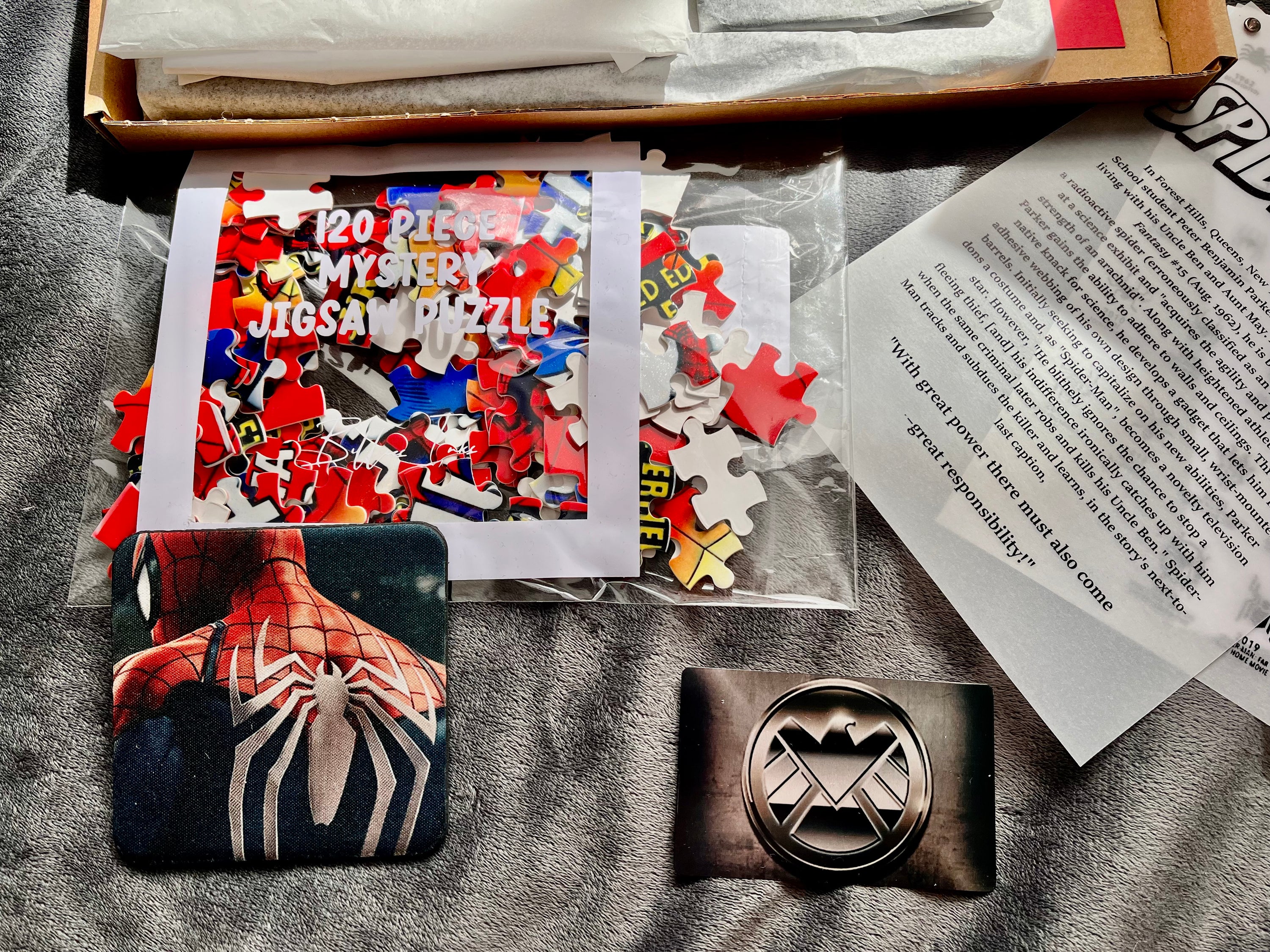 Ultimate Spider-Man Gift Set Part 2 featuring framed comic print, bookmark, keyring, coaster, jigsaw puzzle, and educational materials.