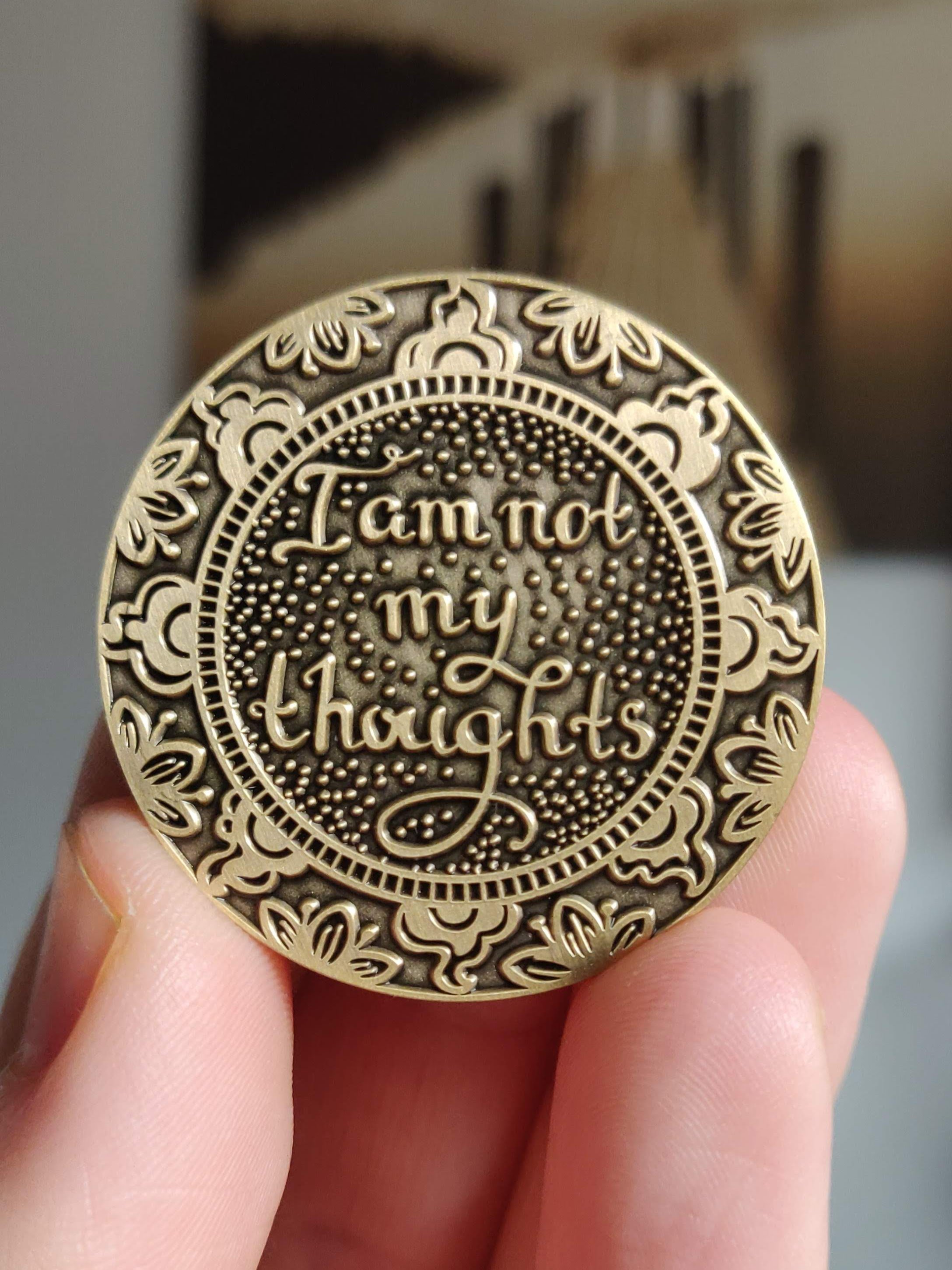 A beautifully designed I Am Not My Thoughts Mantra Medallion featuring a heart symbol, mindfulness imagery, and a tree of life, representing love and tranquility.
