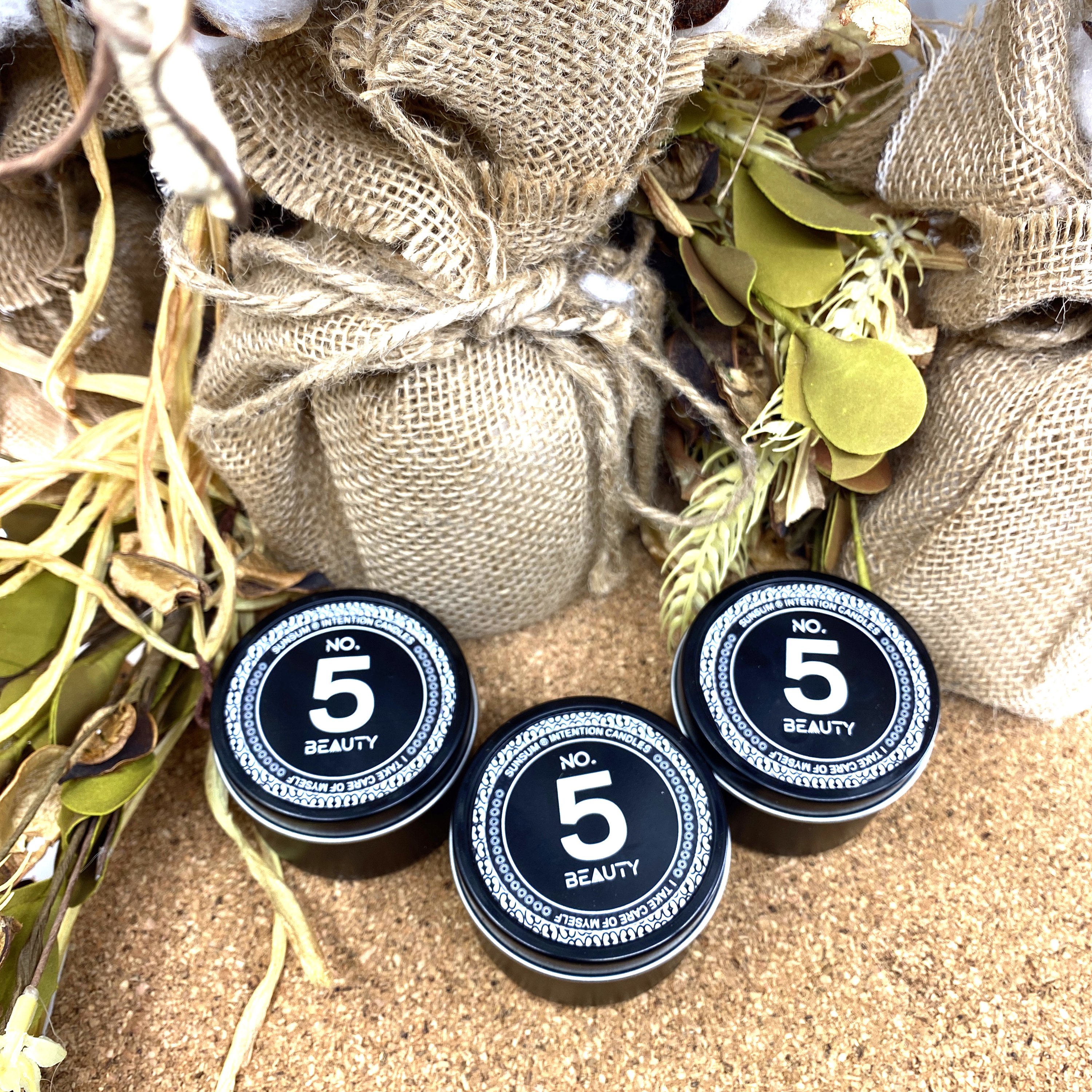 Spirit Number 555 Gift Set featuring handmade products including candles, body oils, and wax melts with floral and fruity aromas.