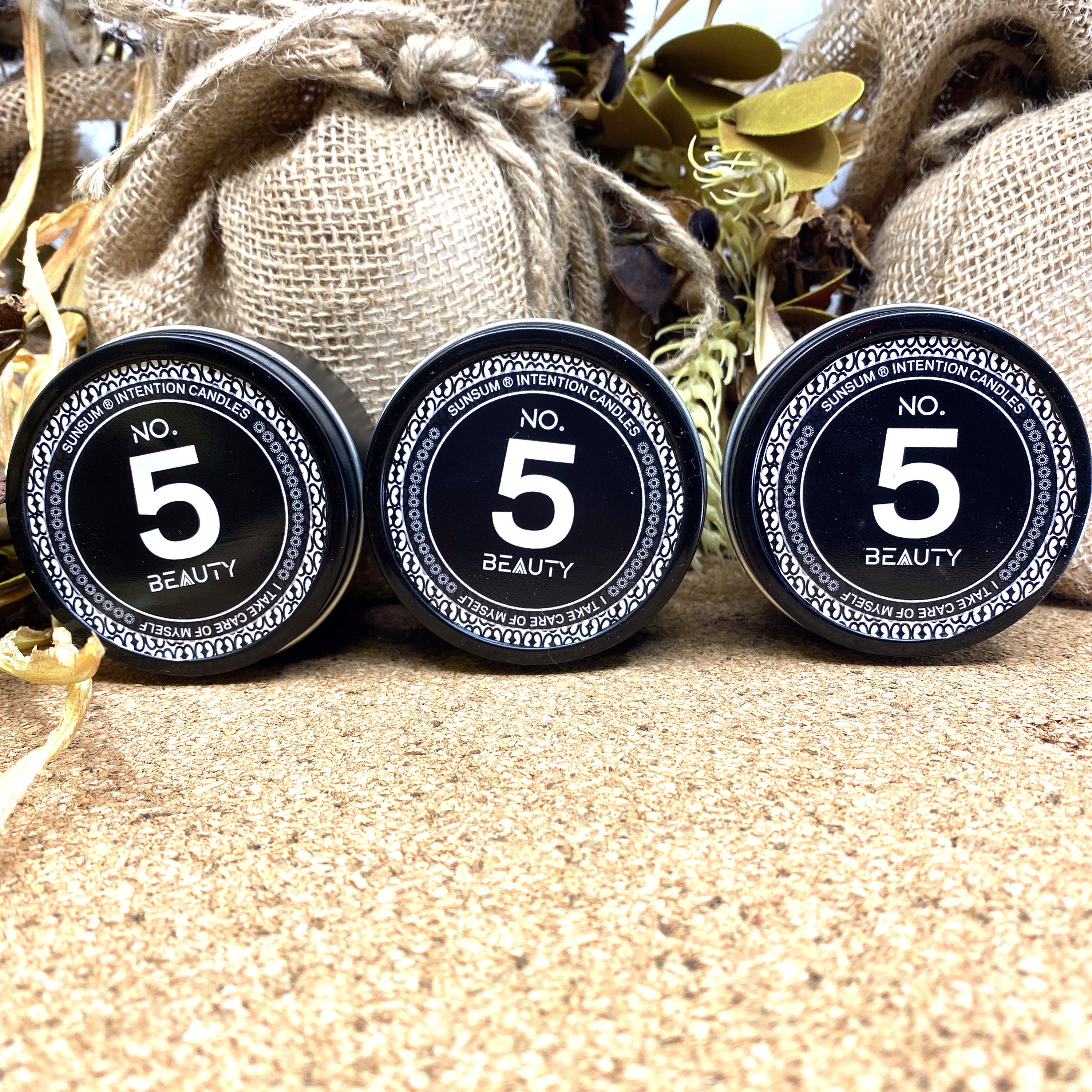 Spirit Number 555 Gift Set featuring handmade products including candles, body oils, and wax melts with floral and fruity aromas.