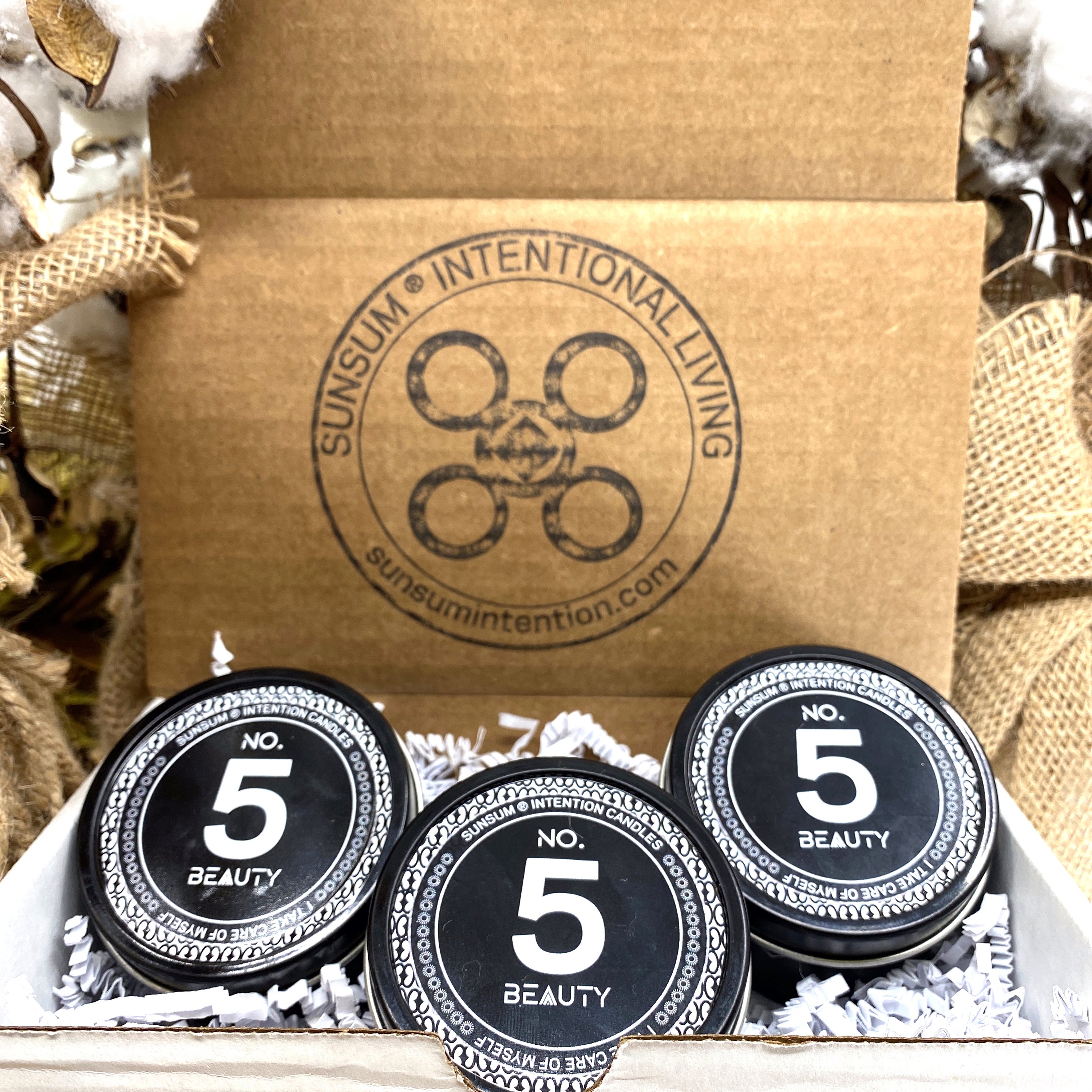 Spirit Number 555 Gift Set featuring handmade products including candles, body oils, and wax melts with floral and fruity aromas.