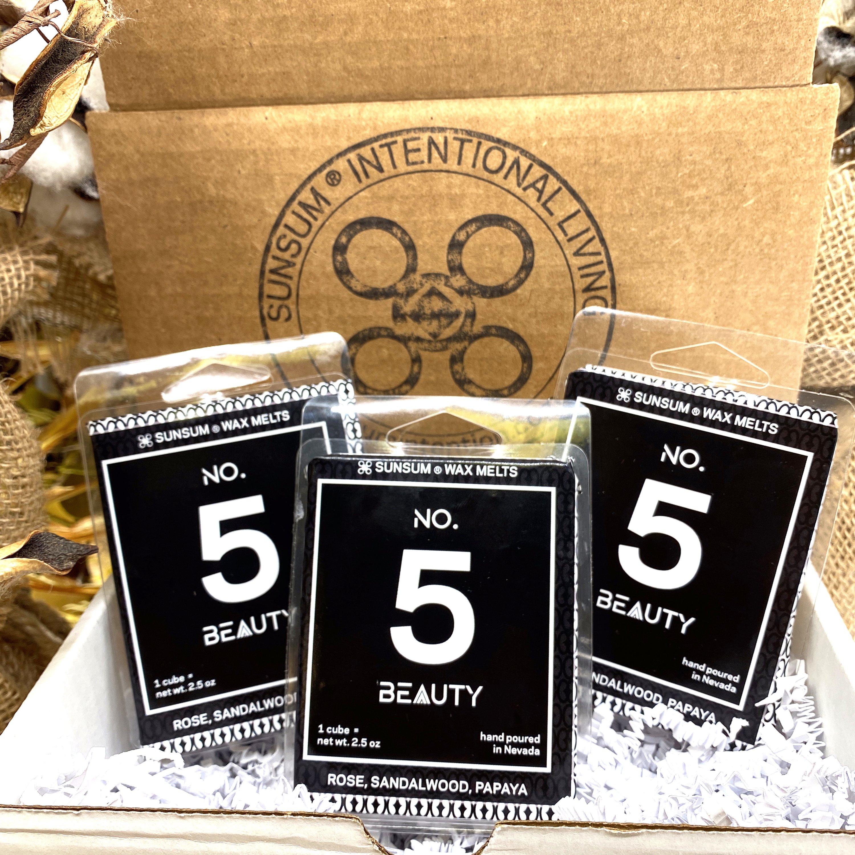 Spirit Number 555 Gift Set featuring handmade products including candles, body oils, and wax melts with floral and fruity aromas.