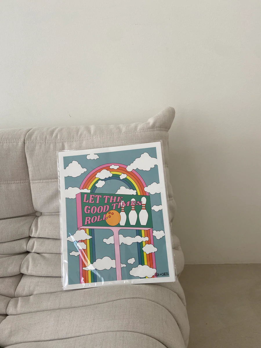 A vibrant printed poster featuring the phrase 'Let the Good Times Roll' designed by Ashley Molesso, perfect for home decor.