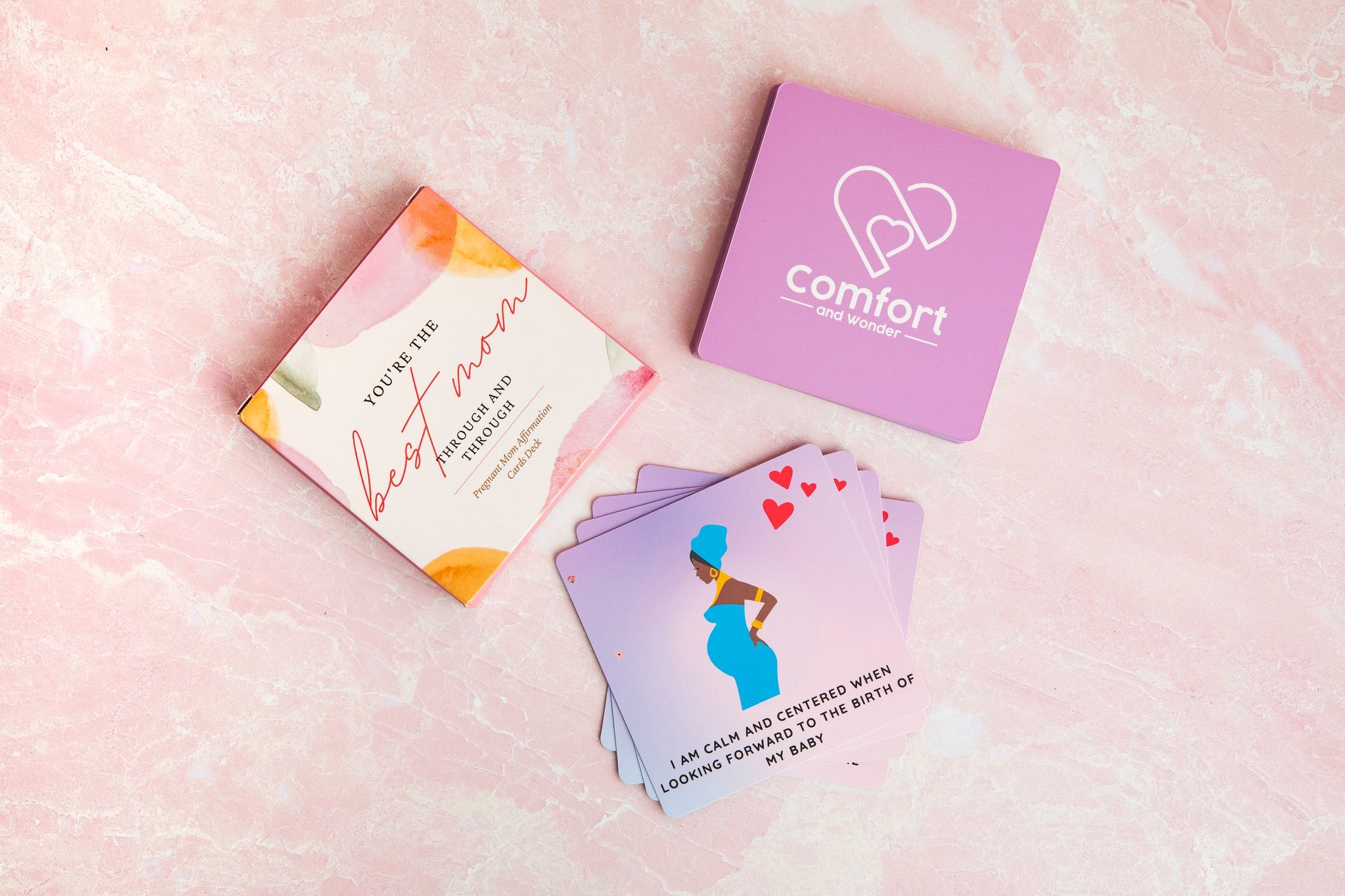 A beautifully designed set of 30 affirmation cards for pregnant moms, featuring hand-lettered quotes and vibrant colors.