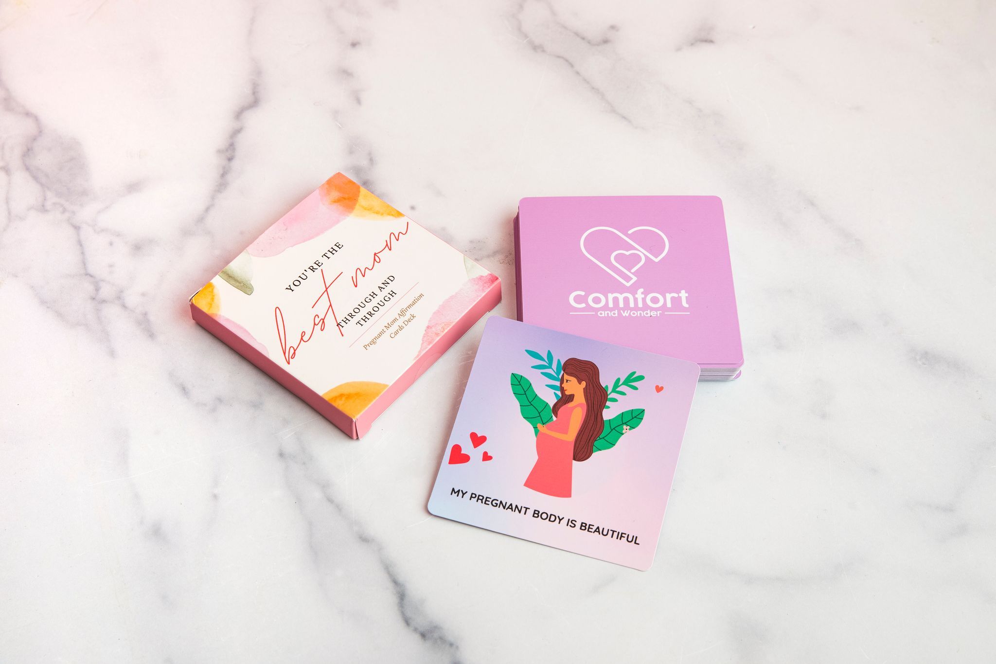 A beautifully designed set of 30 affirmation cards for pregnant moms, featuring hand-lettered quotes and vibrant colors.