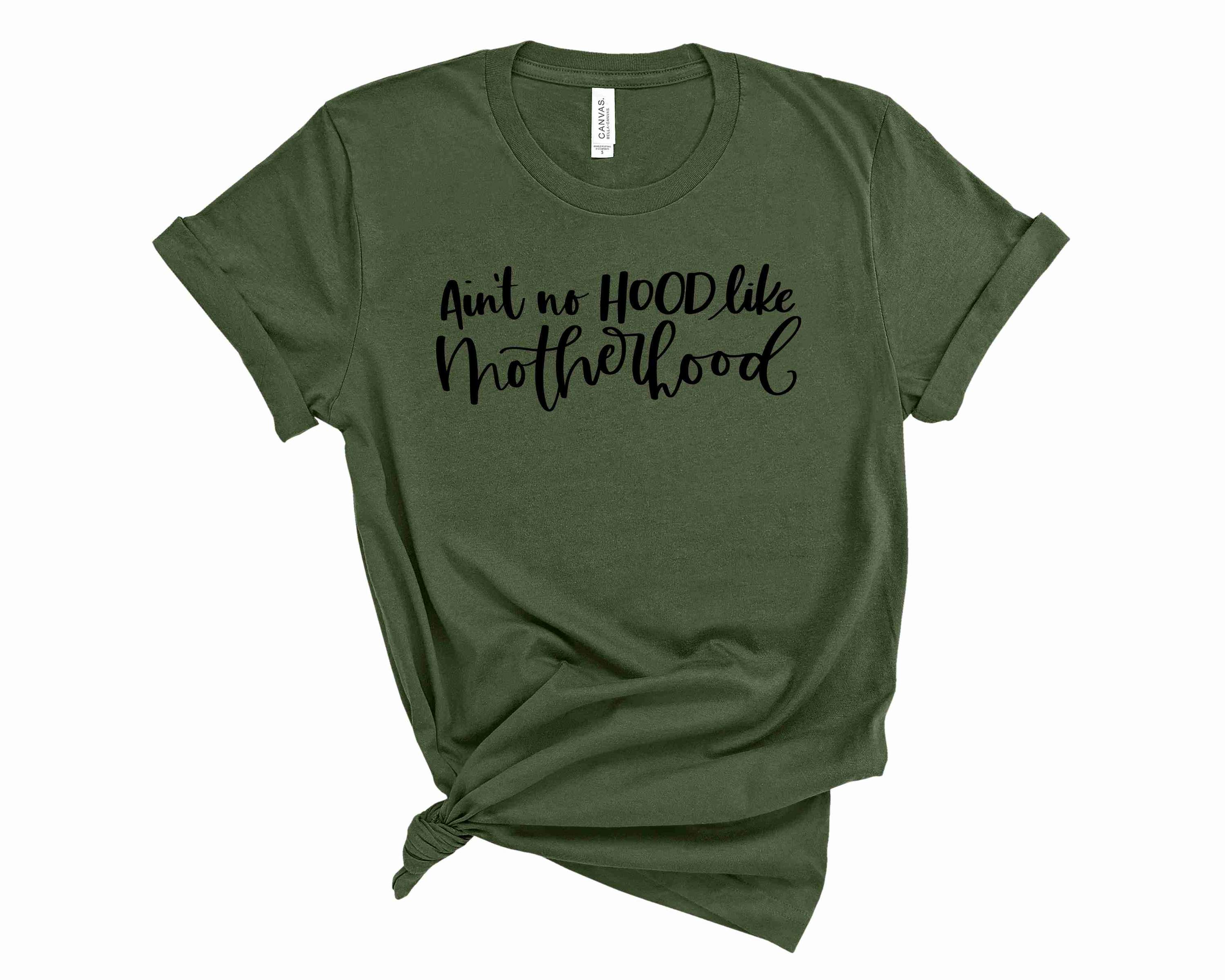 A stylish unisex graphic tee featuring the phrase 'Ain't no hood like Motherhood' in vibrant colors.