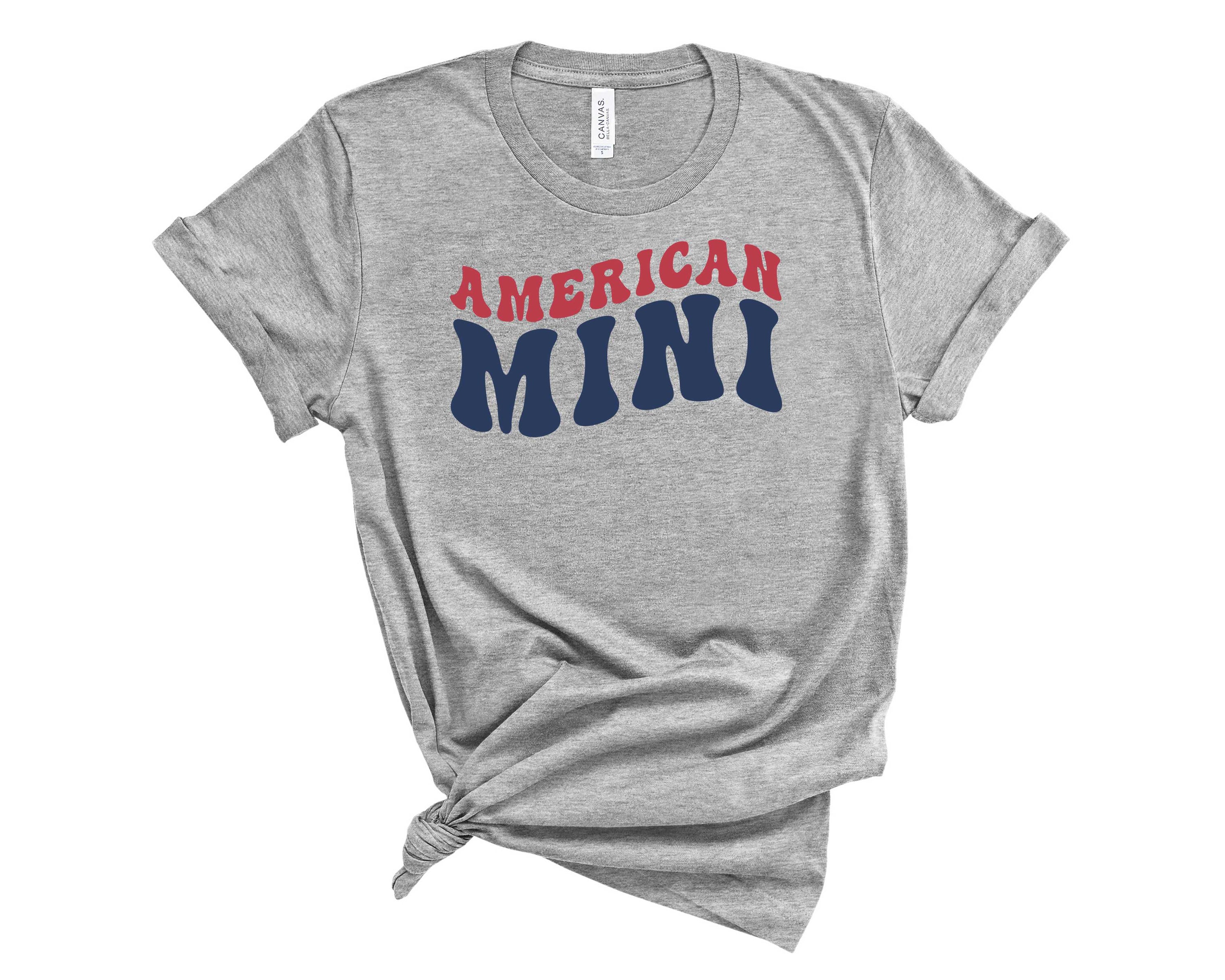 American Mini Graphic Tee featuring a stylish design, suitable for all genders, made from soft fabric.