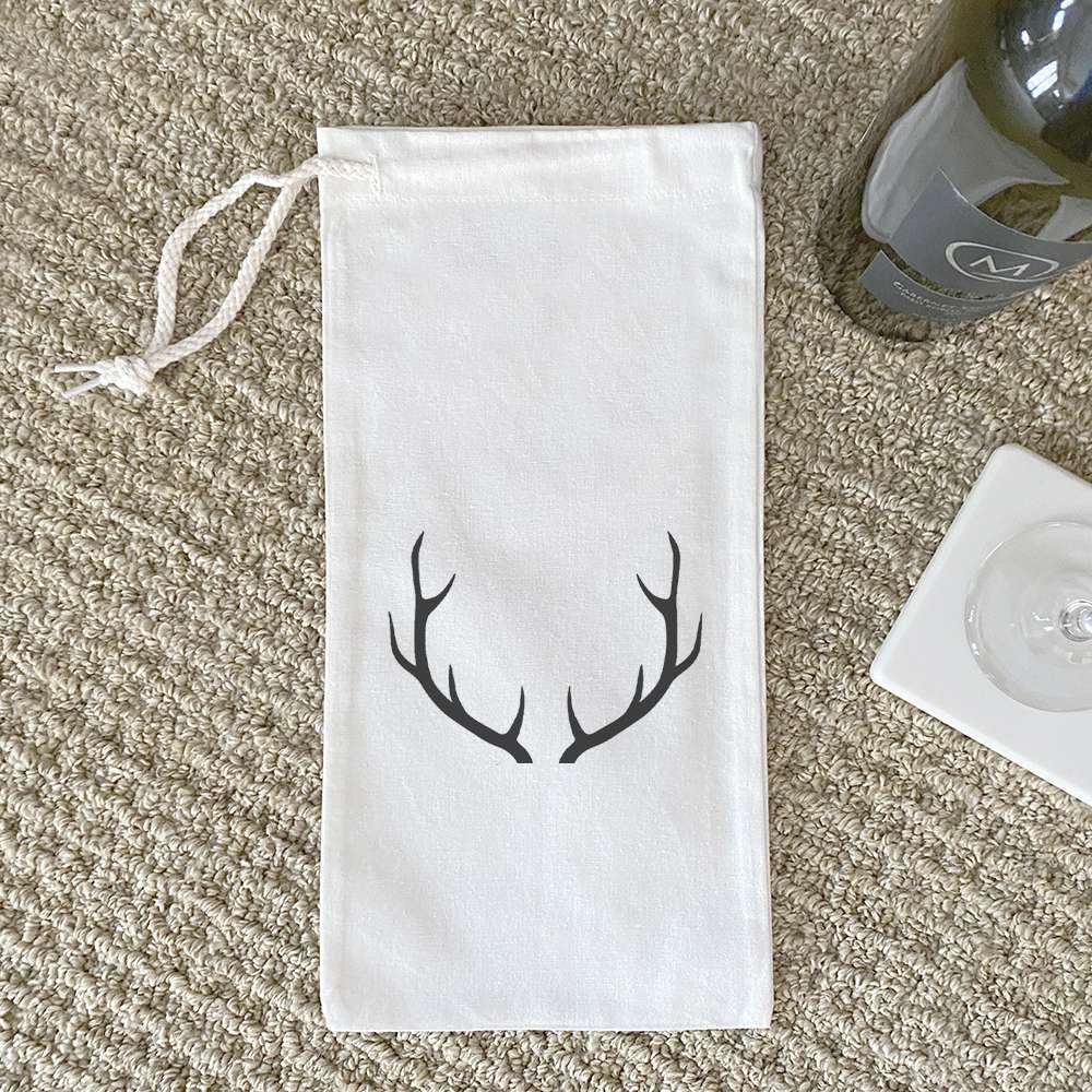 Antlers Canvas Wine Bag featuring a stylish design with a drawstring closure, perfect for carrying wine bottles.