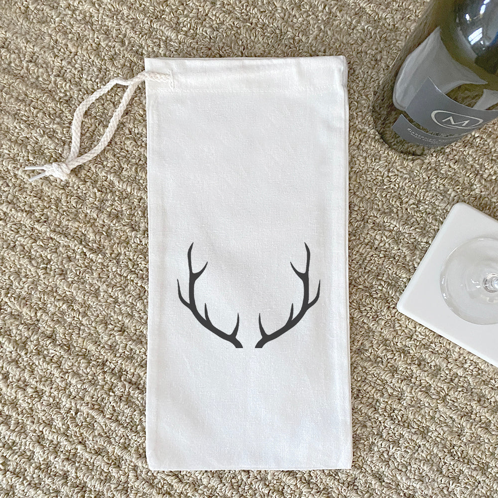 Antlers Canvas Wine Bag featuring a stylish design with a drawstring closure, perfect for carrying wine bottles.