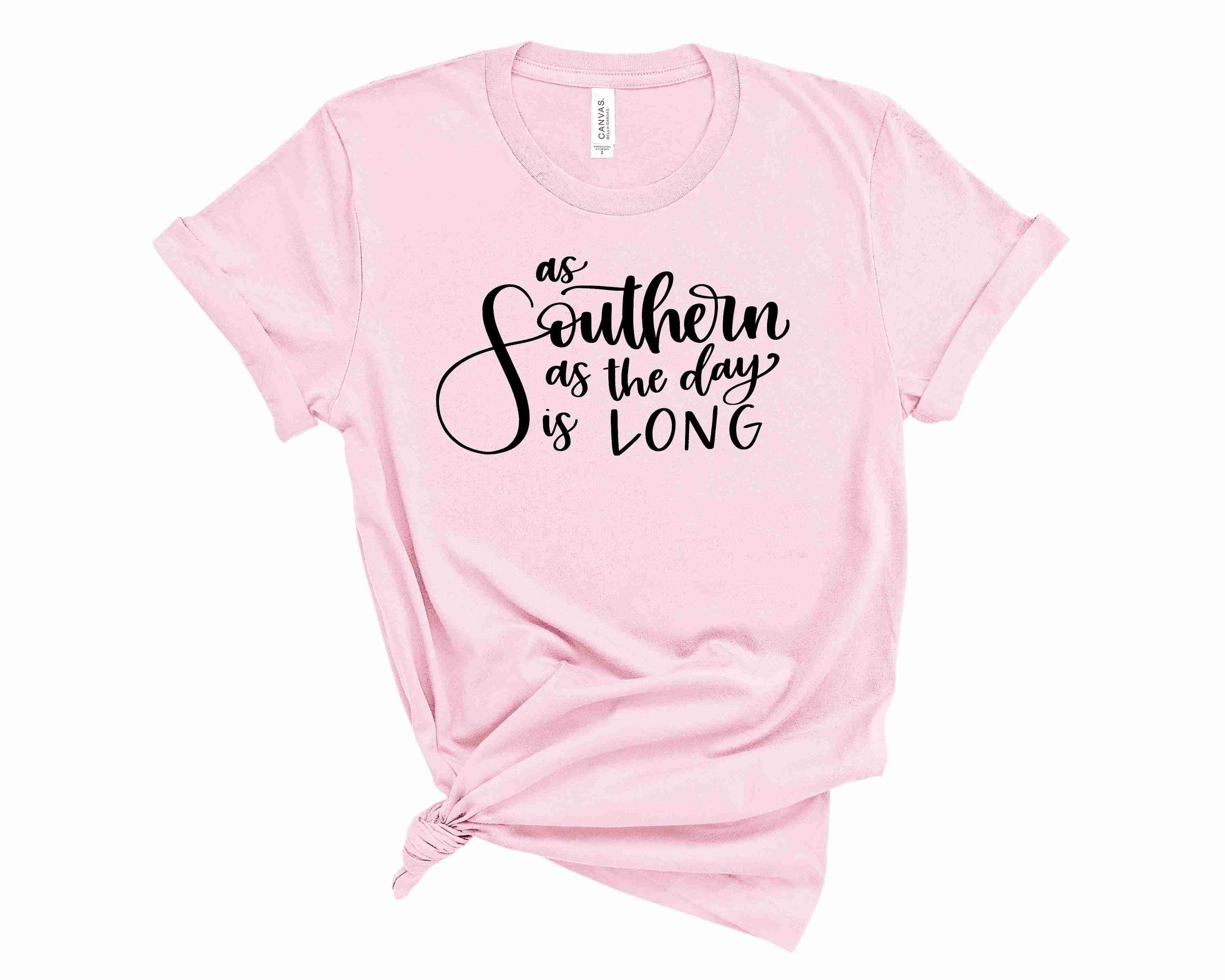A unisex graphic tee featuring the phrase 'As Southern As The Day is Long' in a stylish font, perfect for casual wear.
