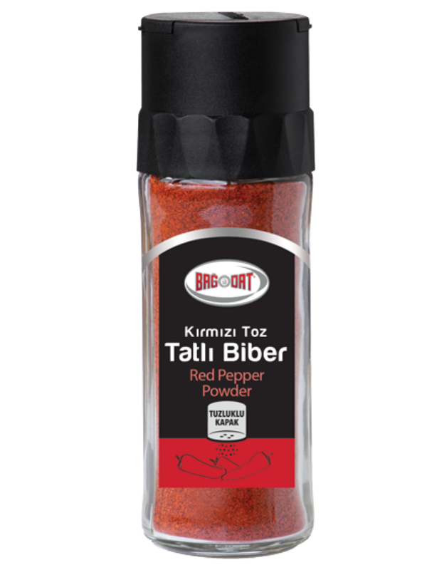 A jar of Bagdat Red Pepper Powder showcasing its vibrant red color, perfect for enhancing dishes.