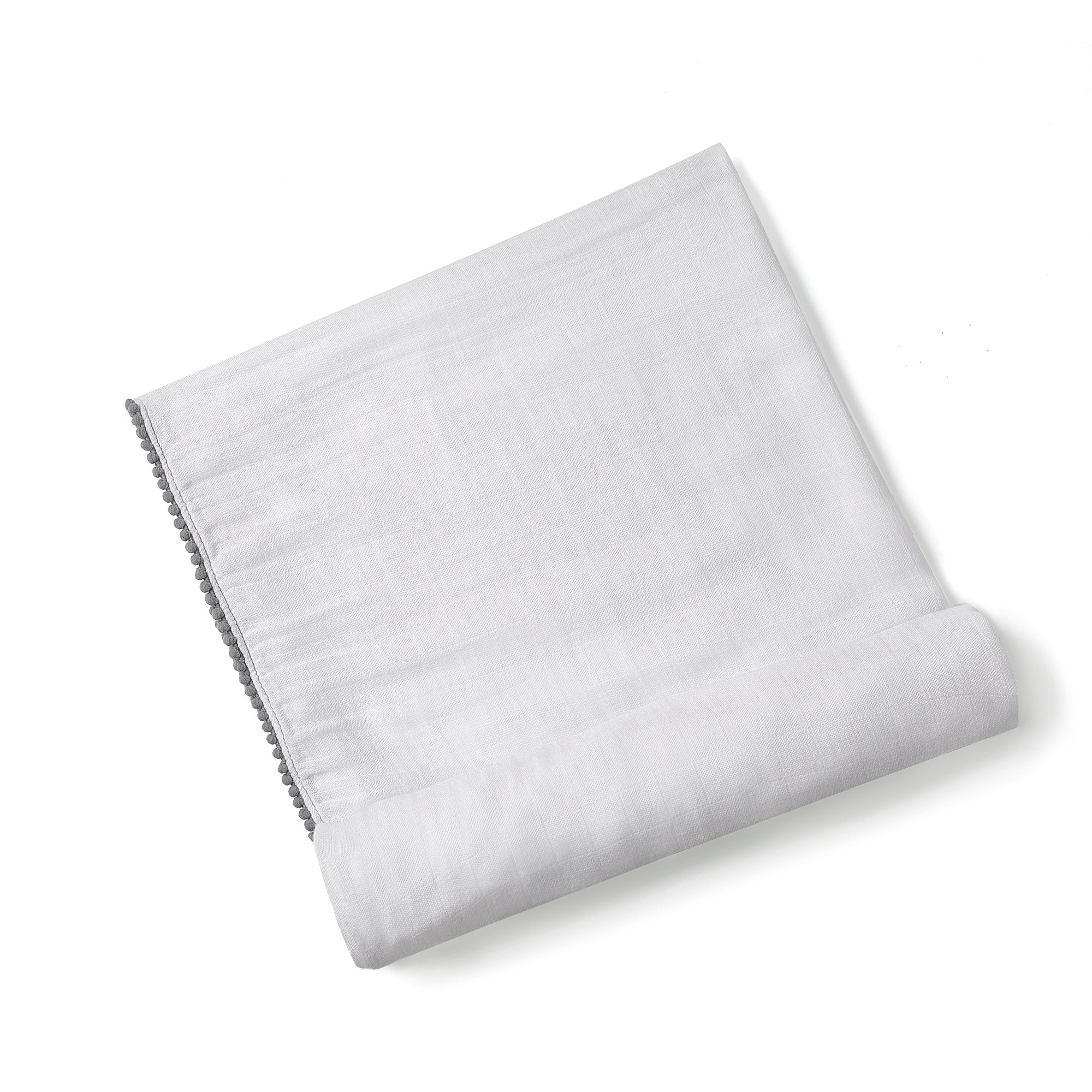 A soft bamboo and cotton swaddle featuring playful pom pom trim, perfect for newborns to toddlers.