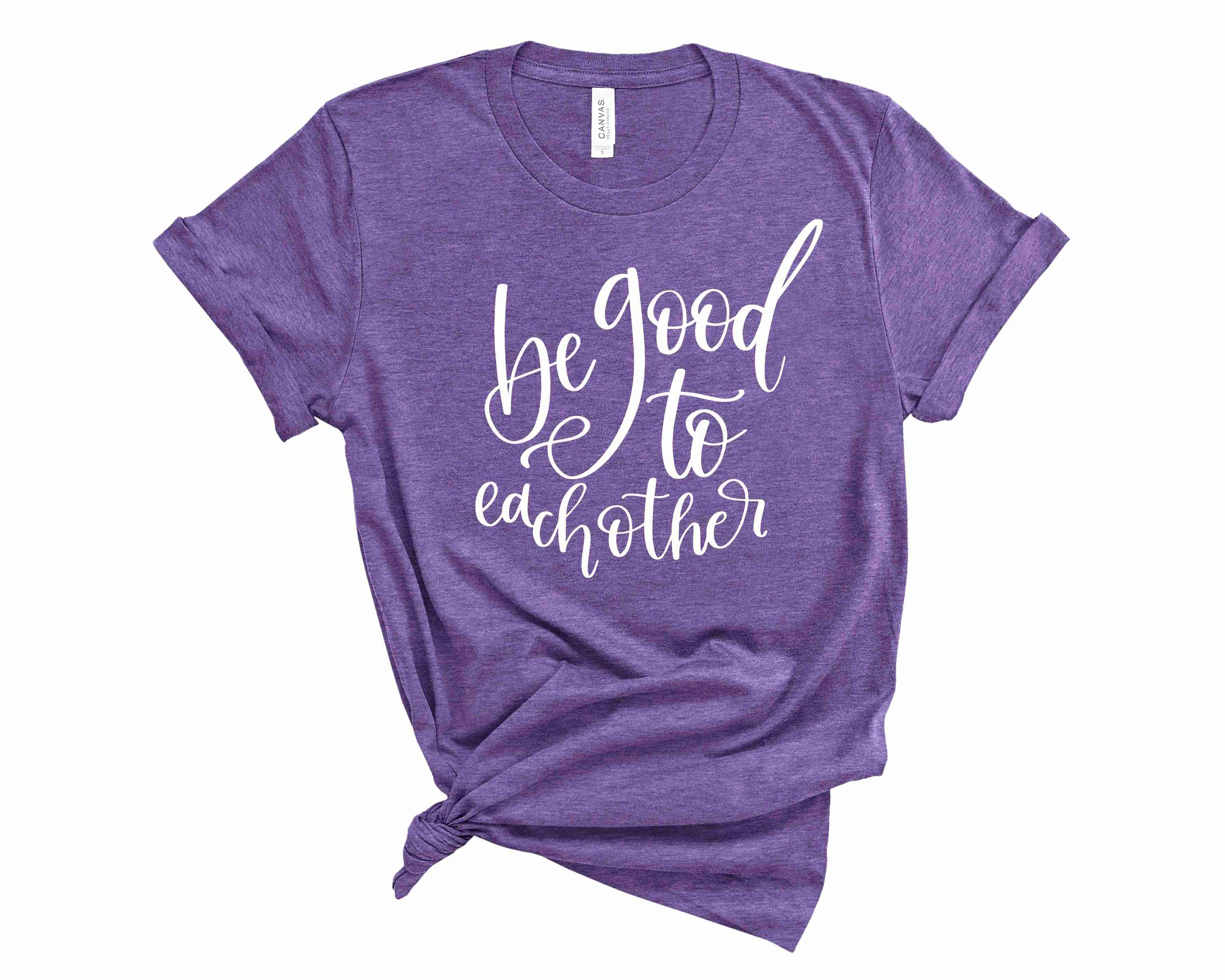 A unisex graphic tee featuring the phrase 'Be Good to Each Other' in a stylish font, perfect for casual wear.