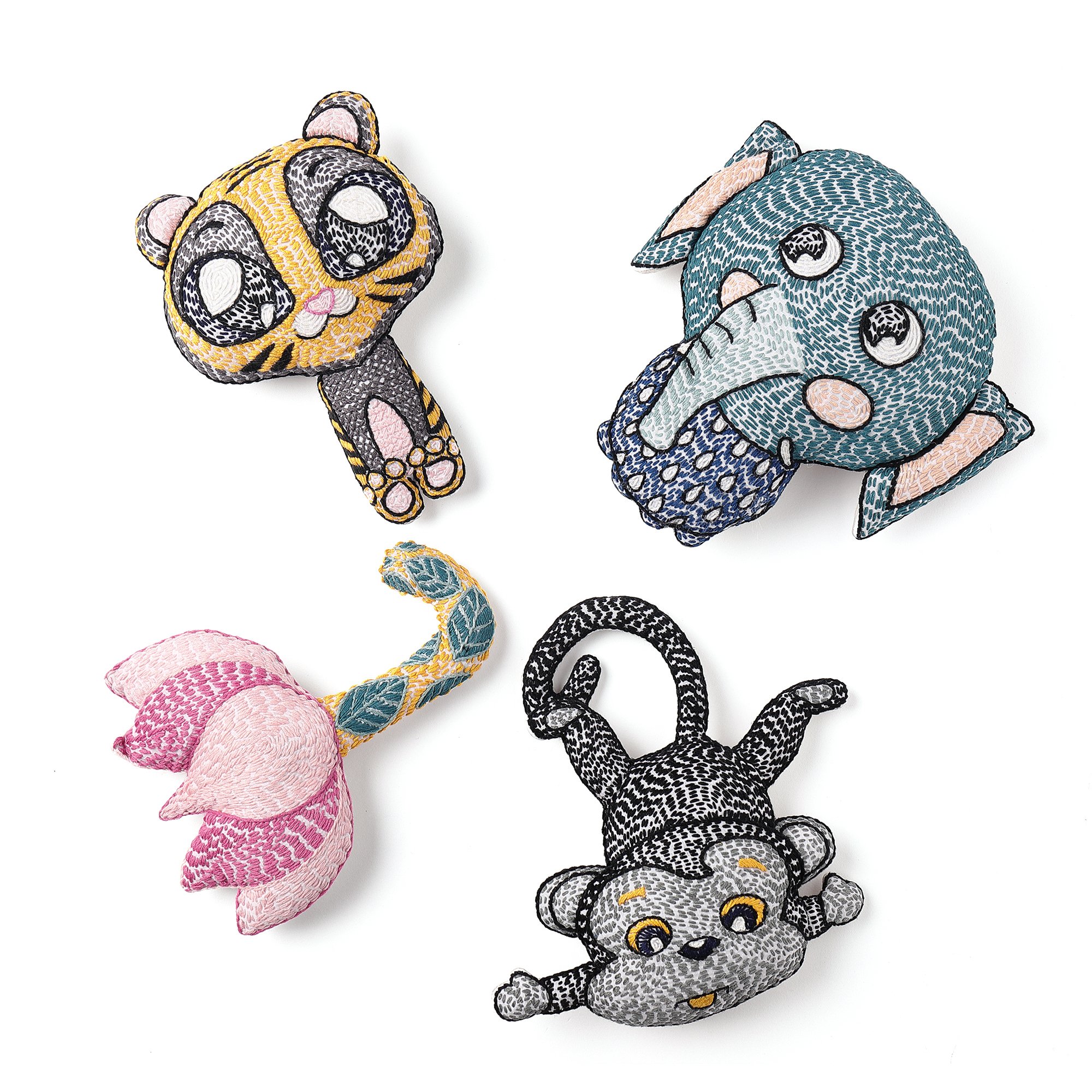 A handcrafted plush toy of Mani the Monkey, featuring vibrant colors and traditional Kantha stitching, perfect for children's nurseries.