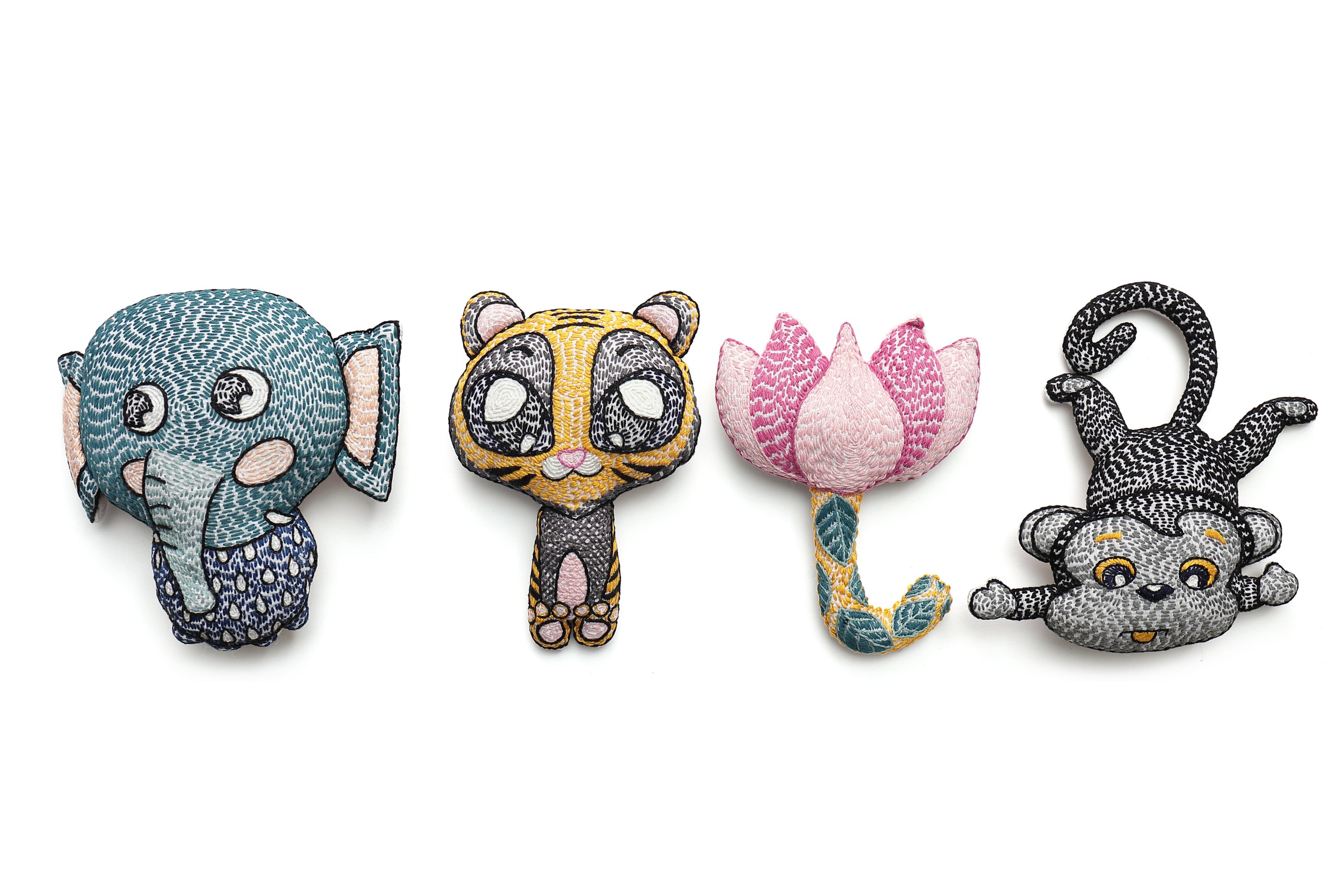 A handcrafted plush toy of Mani the Monkey, featuring vibrant colors and traditional Kantha stitching, perfect for children's nurseries.