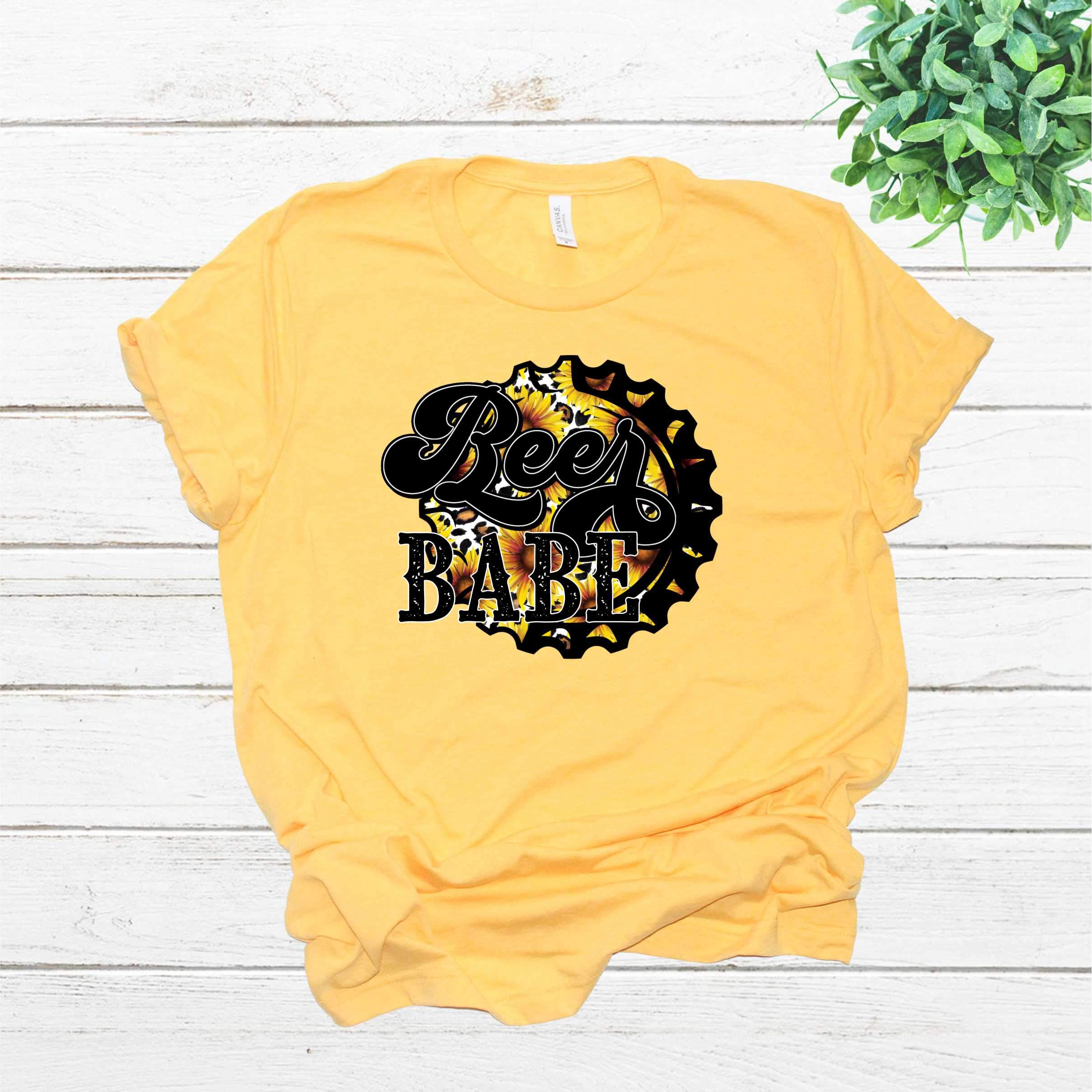 Beer Babe Sunflower Graphic Tee featuring a vibrant sunflower design on a unisex t-shirt.