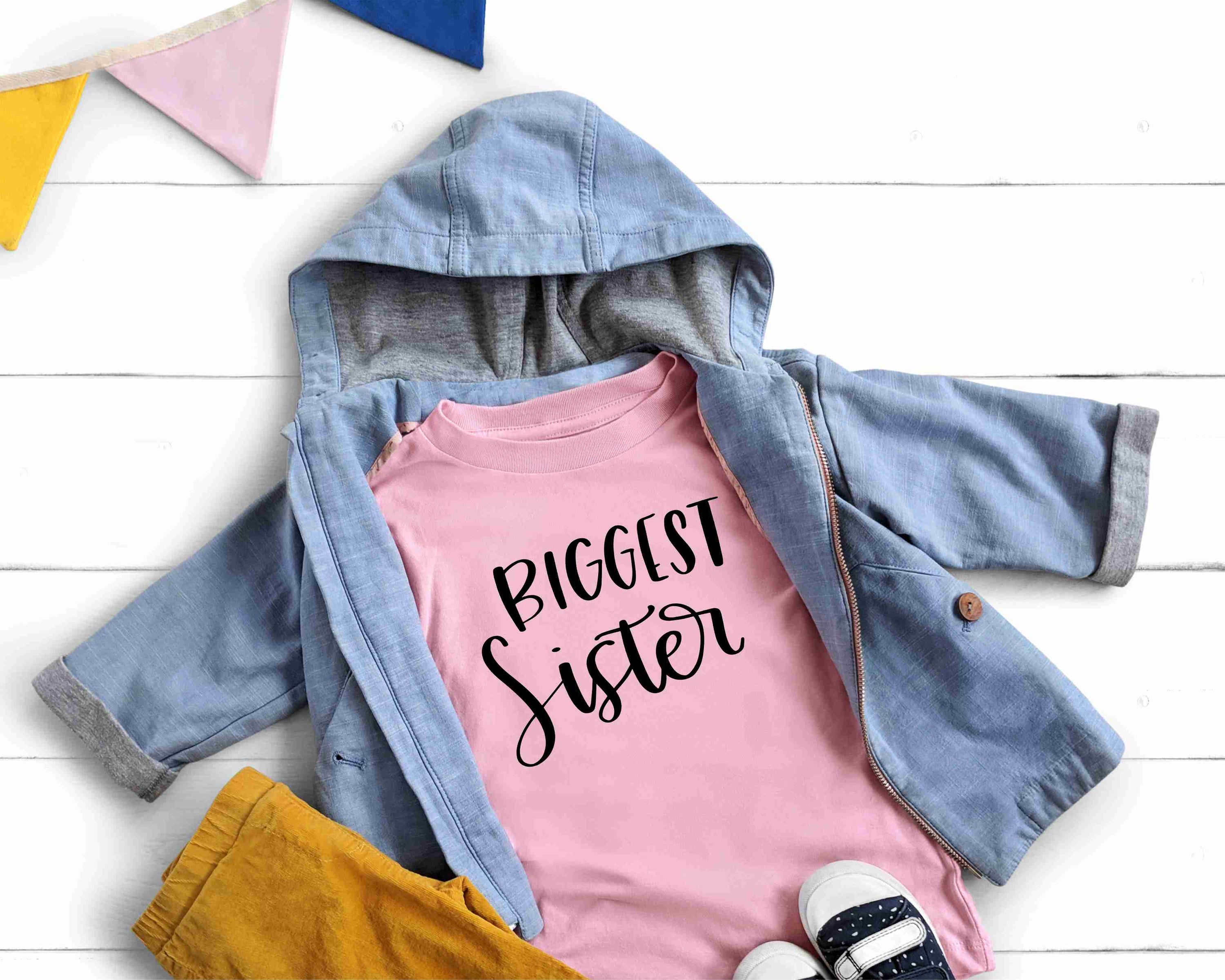 Biggest Sister Graphic Tee featuring a stylish design on a soft unisex t-shirt.