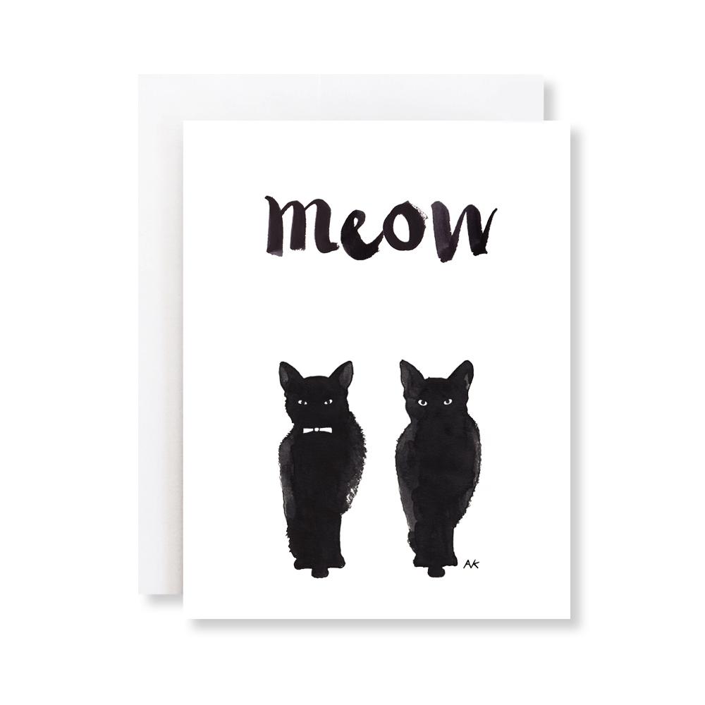 A beautifully illustrated black cat on a greeting card, featuring a crystal or orange metallic envelope.