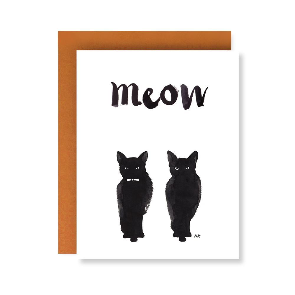 A beautifully illustrated black cat on a greeting card, featuring a crystal or orange metallic envelope.