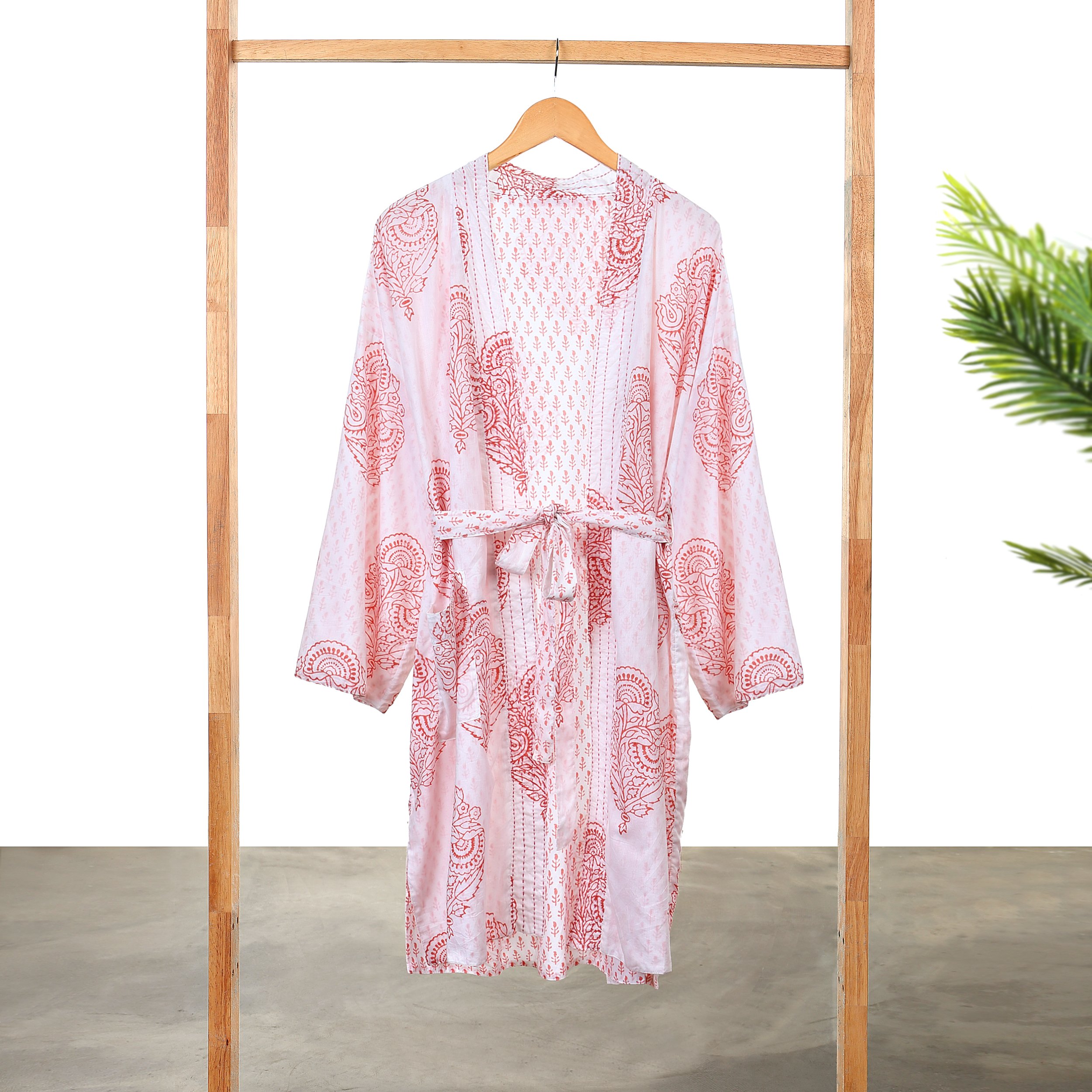A beautiful reversible block-printed robe in the Pink City design, showcasing intricate hand kantha-stitch work and made from soft Indian Cotton Voile.