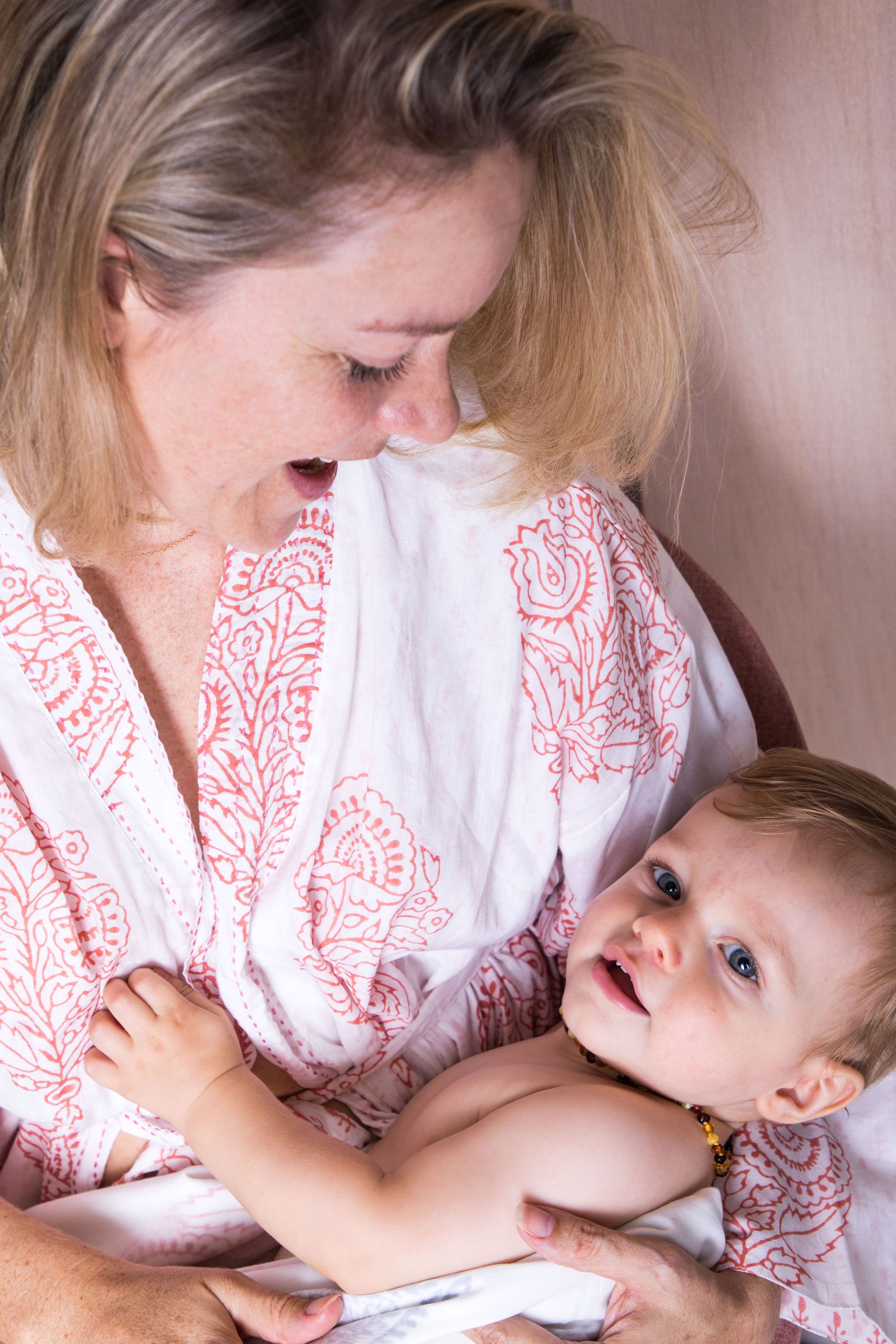 A beautiful reversible block-printed robe in the Pink City design, showcasing intricate hand kantha-stitch work and made from soft Indian Cotton Voile.