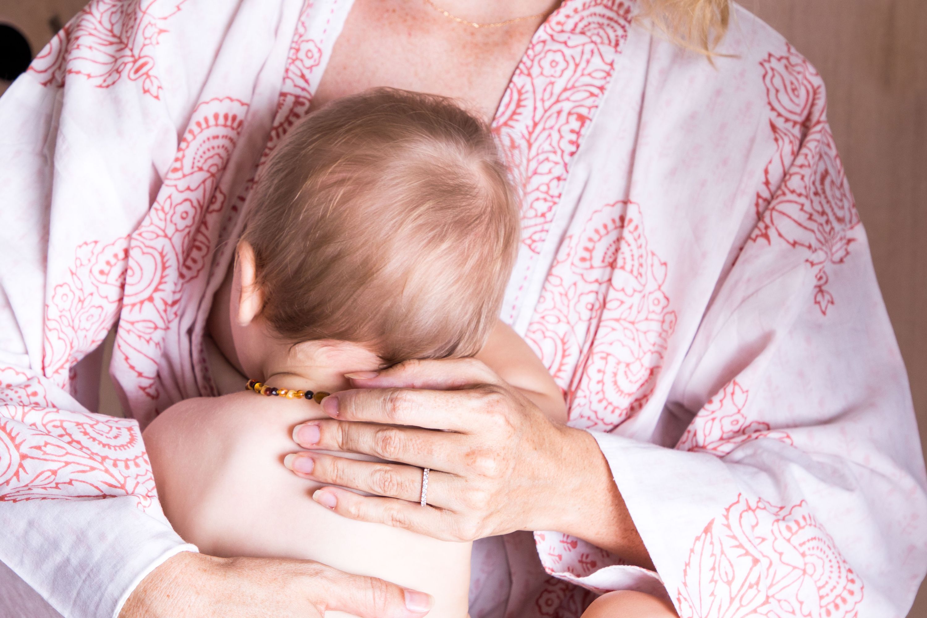 A beautiful reversible block-printed robe in the Pink City design, showcasing intricate hand kantha-stitch work and made from soft Indian Cotton Voile.