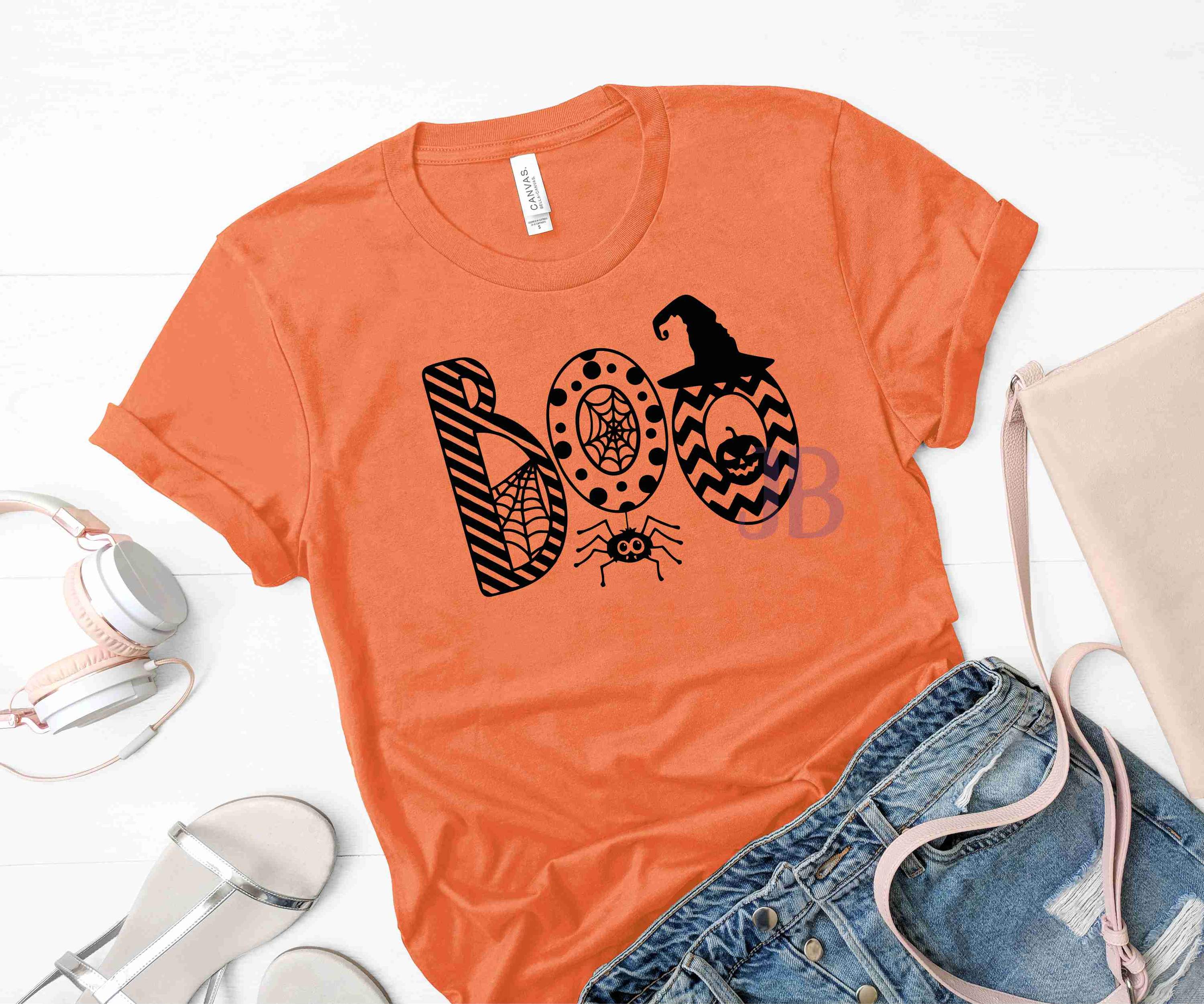 BOO Graphic T-Shirt featuring a playful design on a soft Bella Canvas fabric, available in multiple sizes.