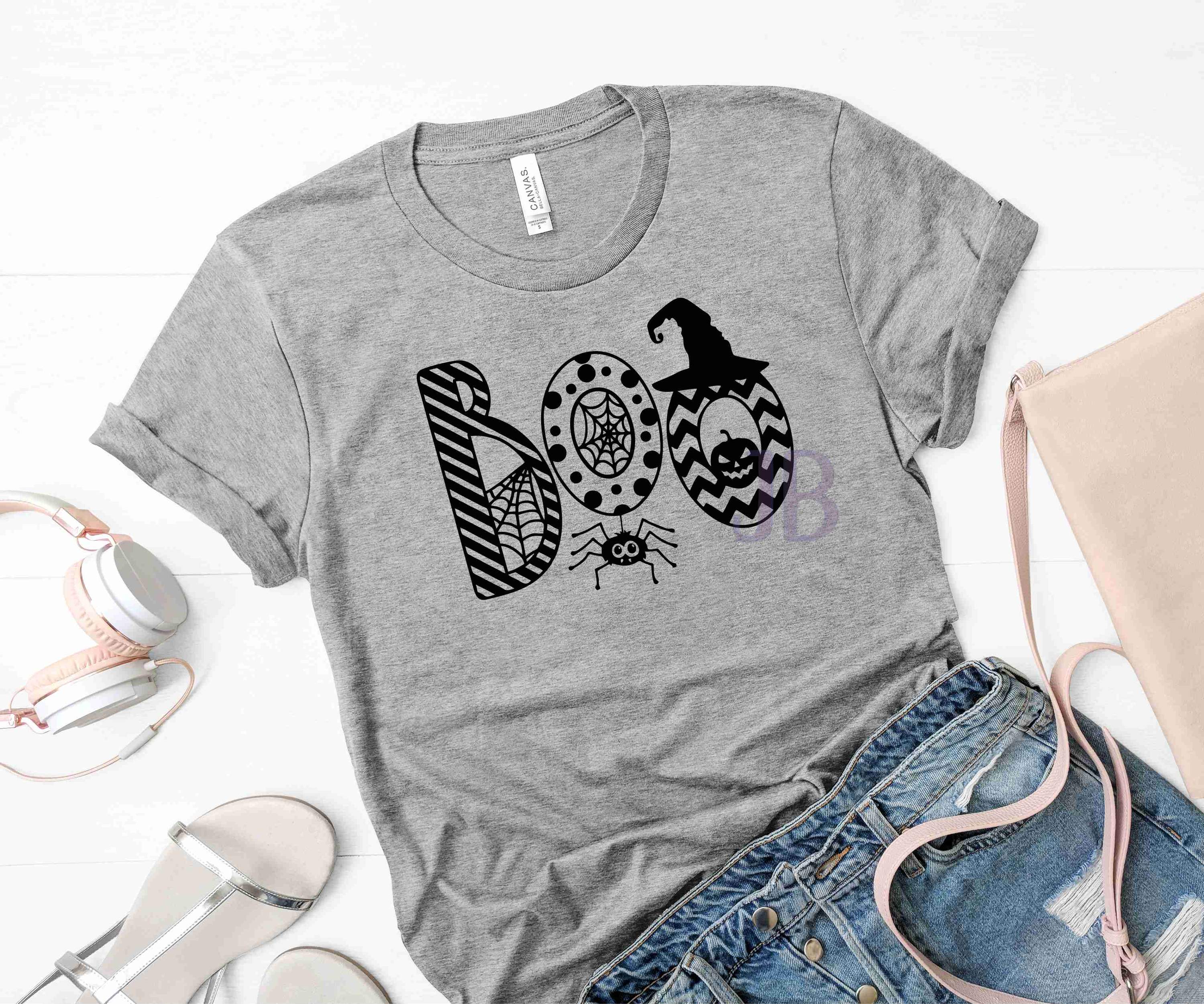 BOO Graphic T-Shirt featuring a playful design on a soft Bella Canvas fabric, available in multiple sizes.