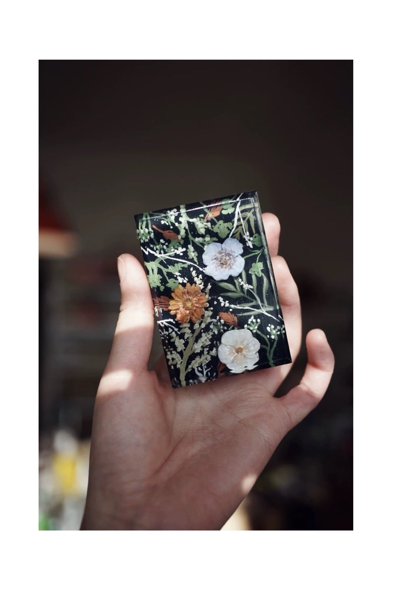 A beautifully arranged set of Botanical Garden Bliss Handmade Soaps, showcasing unique colors and textures, surrounded by natural elements.