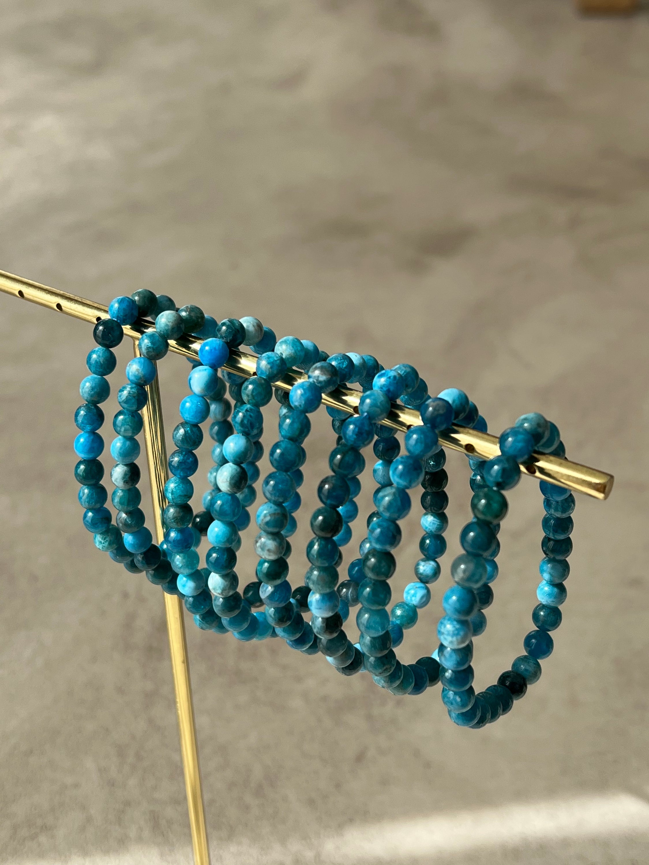 A delicate baby bracelet made of blue apatite beads, symbolizing creativity and inspiration, perfect for enhancing energy.