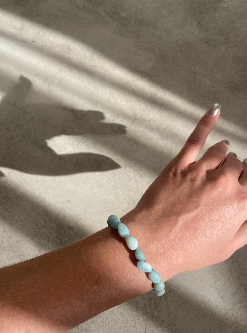A beautiful amazonite bracelet featuring smooth, rounded stones in calming shades of blue and green, symbolizing hope and tranquility.