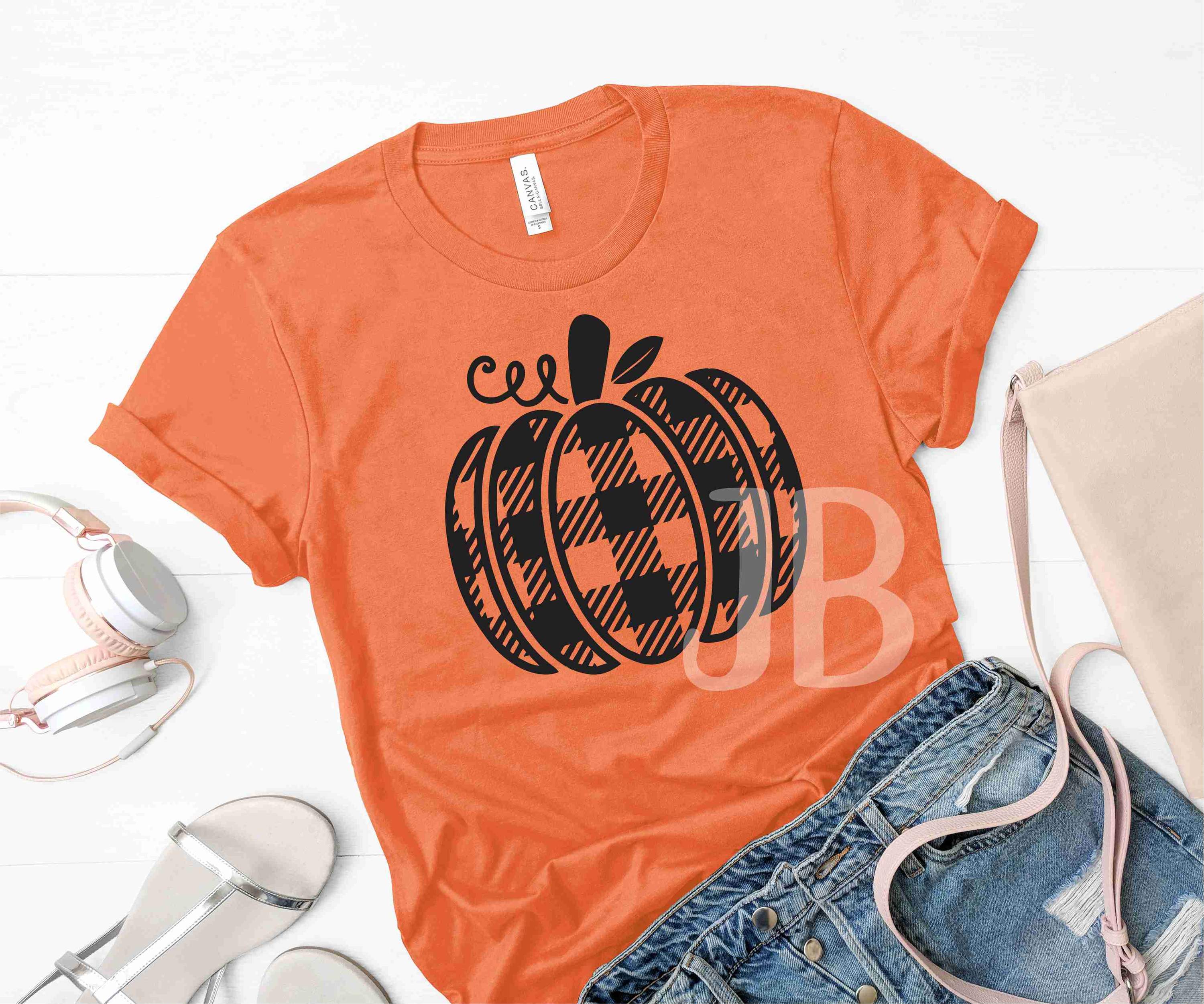 Buffalo Plaid Pumpkin Graphic T-Shirt displayed on a hanger, featuring a vibrant pumpkin design in plaid pattern.