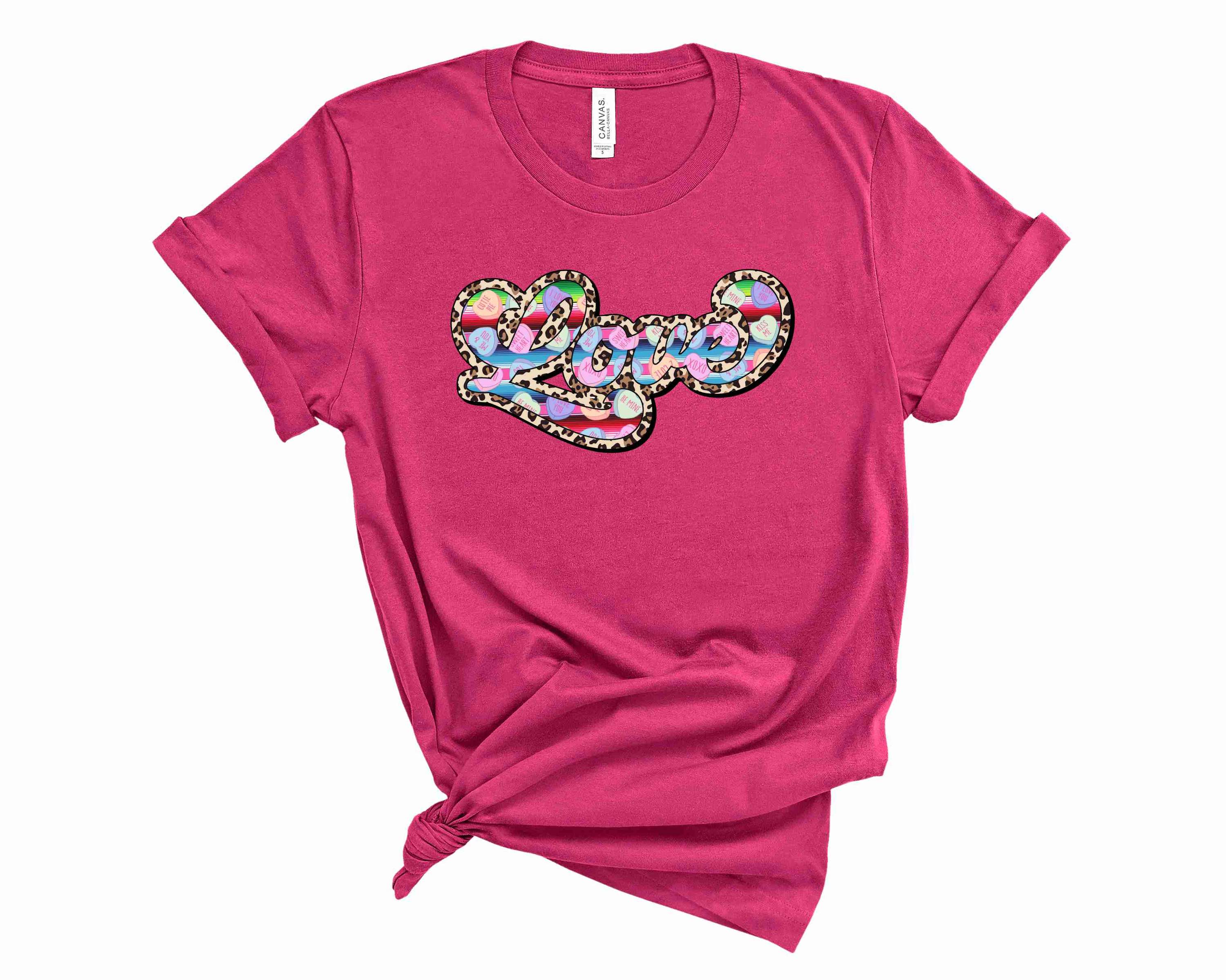 Candy Heart Love graphic tee featuring a colorful candy heart design on a soft fabric.