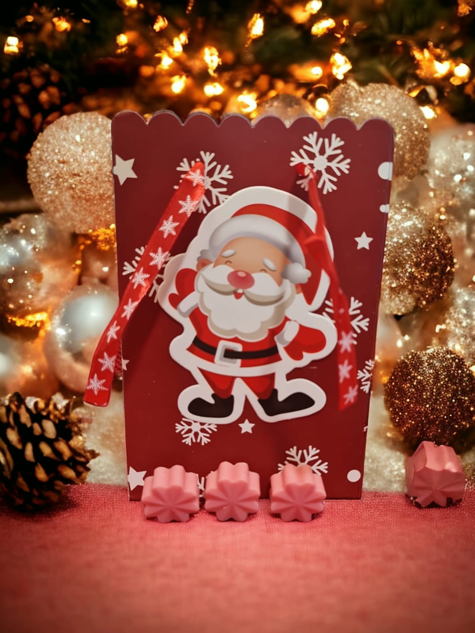 A set of twelve snowflake-shaped wax melts in caramel creamsicle scent, beautifully arranged for a cozy ambiance.